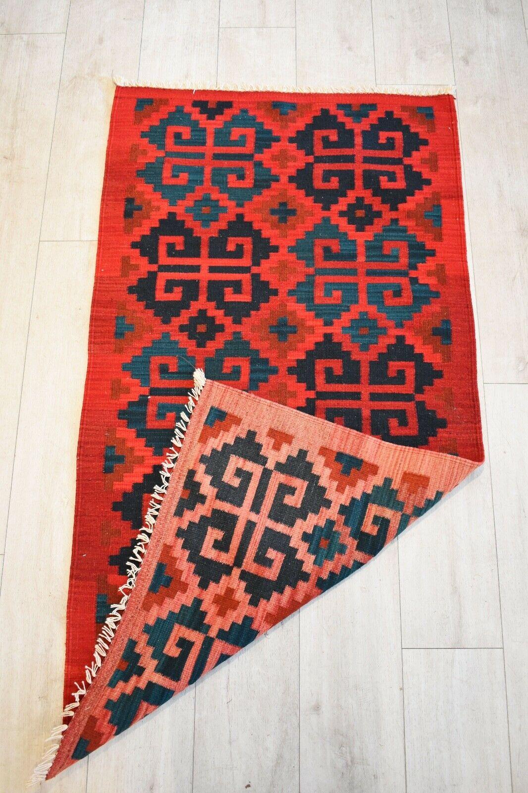 Beautiful handwoven vintage Kilim runner with geometric pattern
Naturally dyed wool in shades of red, black and navy.