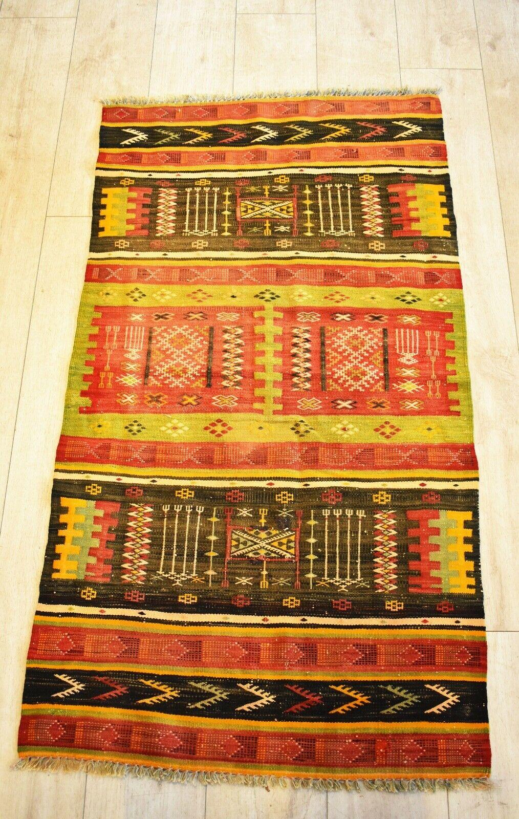 Very rare and unusual beautiful handwoven vintage Kilim runner
with patterns in shades of natural dyed red, black, yellow and green colours.
Handwoven with natural dyes.
Has a lovely aged patina & nice quality.