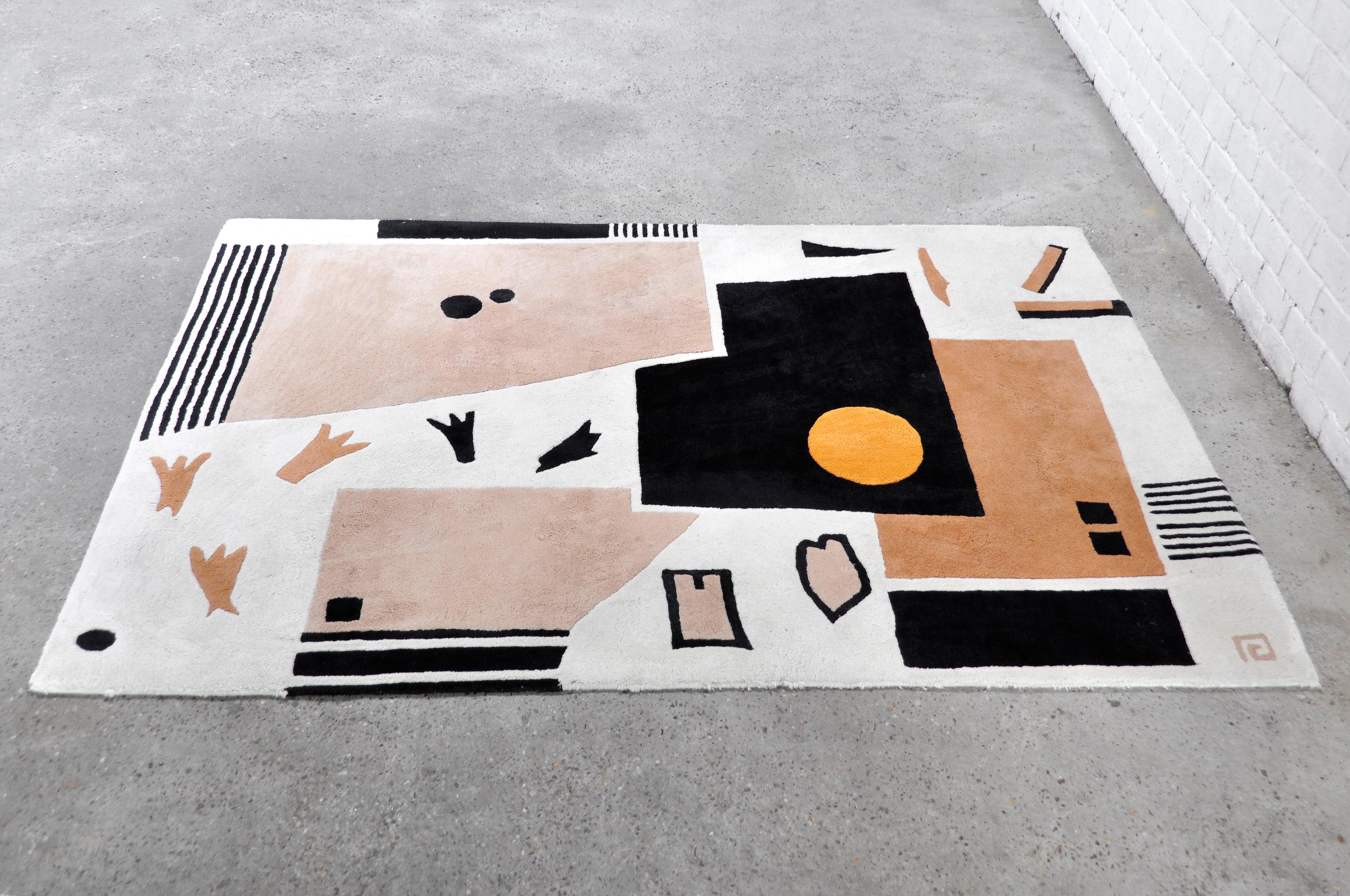 Beautiful high quality rug with abstract geometric design in bauhaus manner. Made out of handwoven wool. Marked on backside but brand unreadable. In very good condition with only light signs of pre-use.