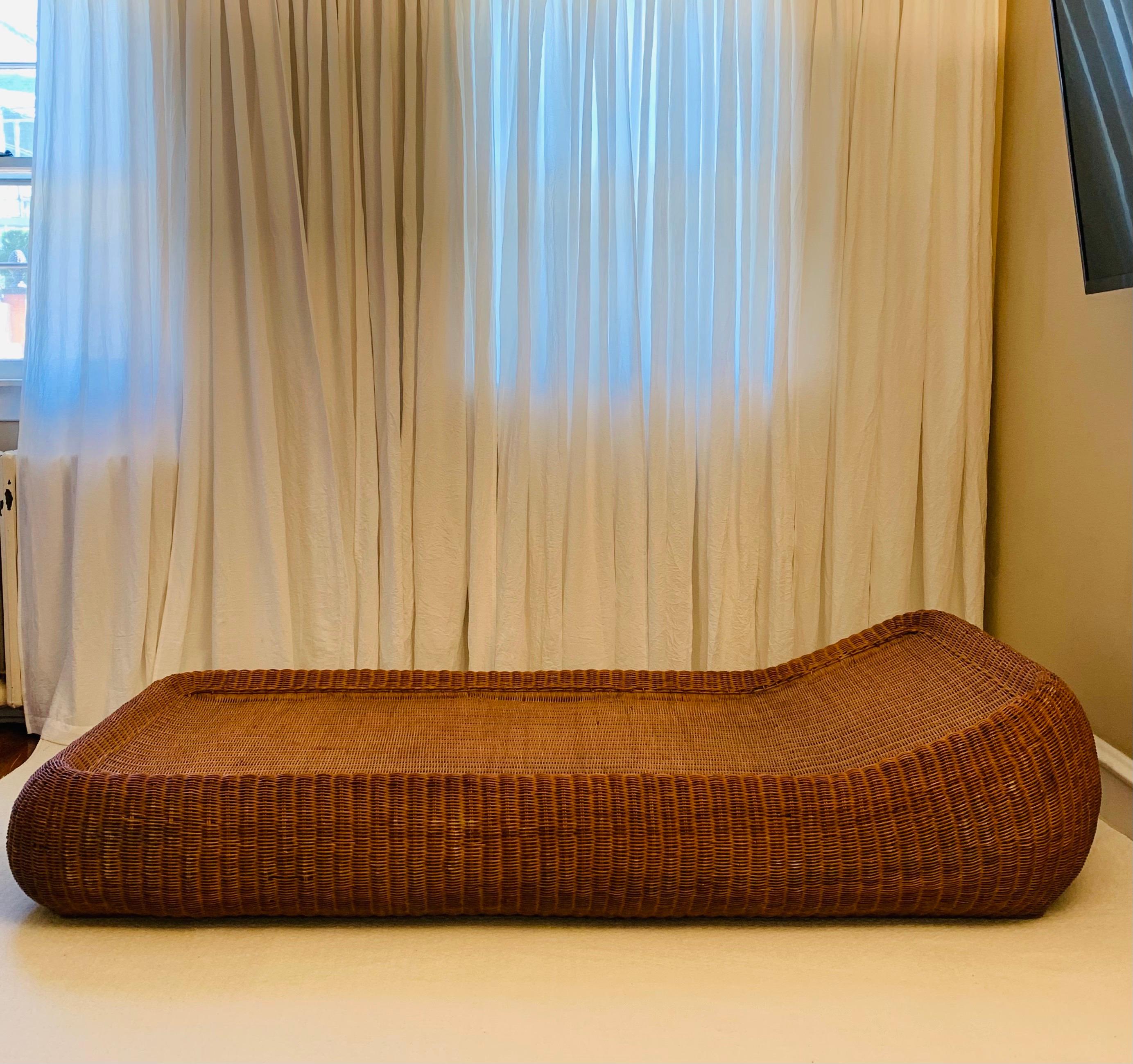 Wonderfully large statement chaise longue. 
This piece is in strong complete condition with no major holes or issues with the rattan.

The original natural hue of the rattan remains and is not stained or discolored, lest for a few small areas.