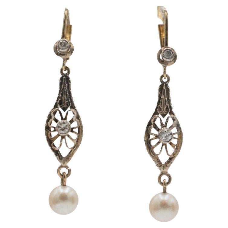 Vintage hanging earrings with pearls and old-cut diamonds circa 1910s.