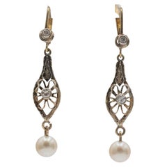 Vintage hanging earrings with pearls and old-cut diamonds circa 1910s.