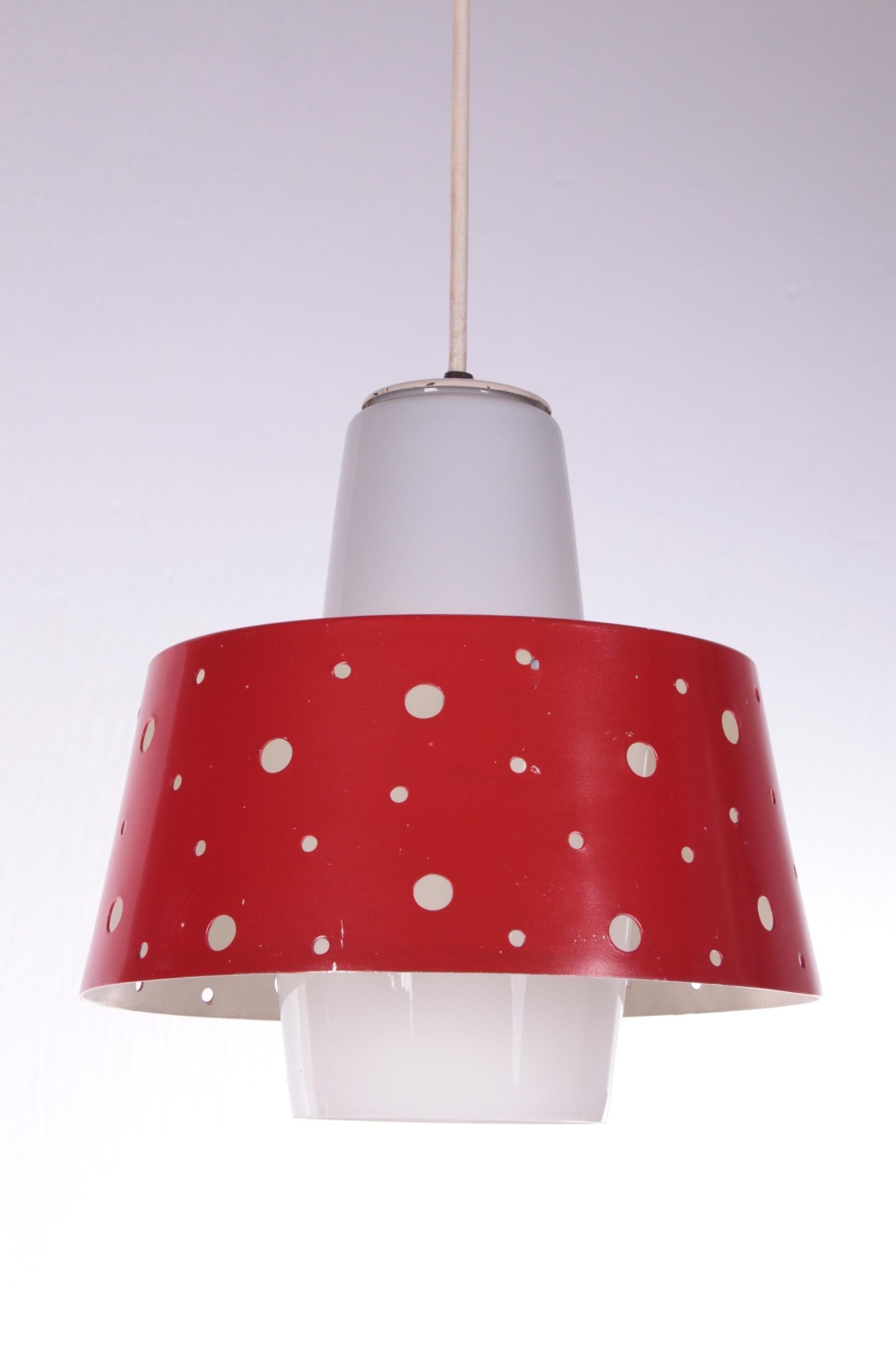 Vintage hanging lamp with glass and metal 1950s


This is a hanging lamp which is made of beautiful white glass with a red matal red border around it with round holes.

The lamp is very similar to the 1950s lamps by Paavo Tynell from