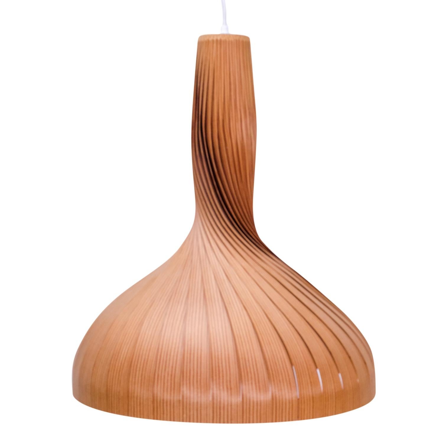 Vintage pendant produced by AB Markaryd, Sweden, design Hans-Agne Jakobsson:

Whether these lamps are turned on or off, they are real eye catchers in any interior, beautifully created with many layers of pinewood bent into a “swirl” that widens