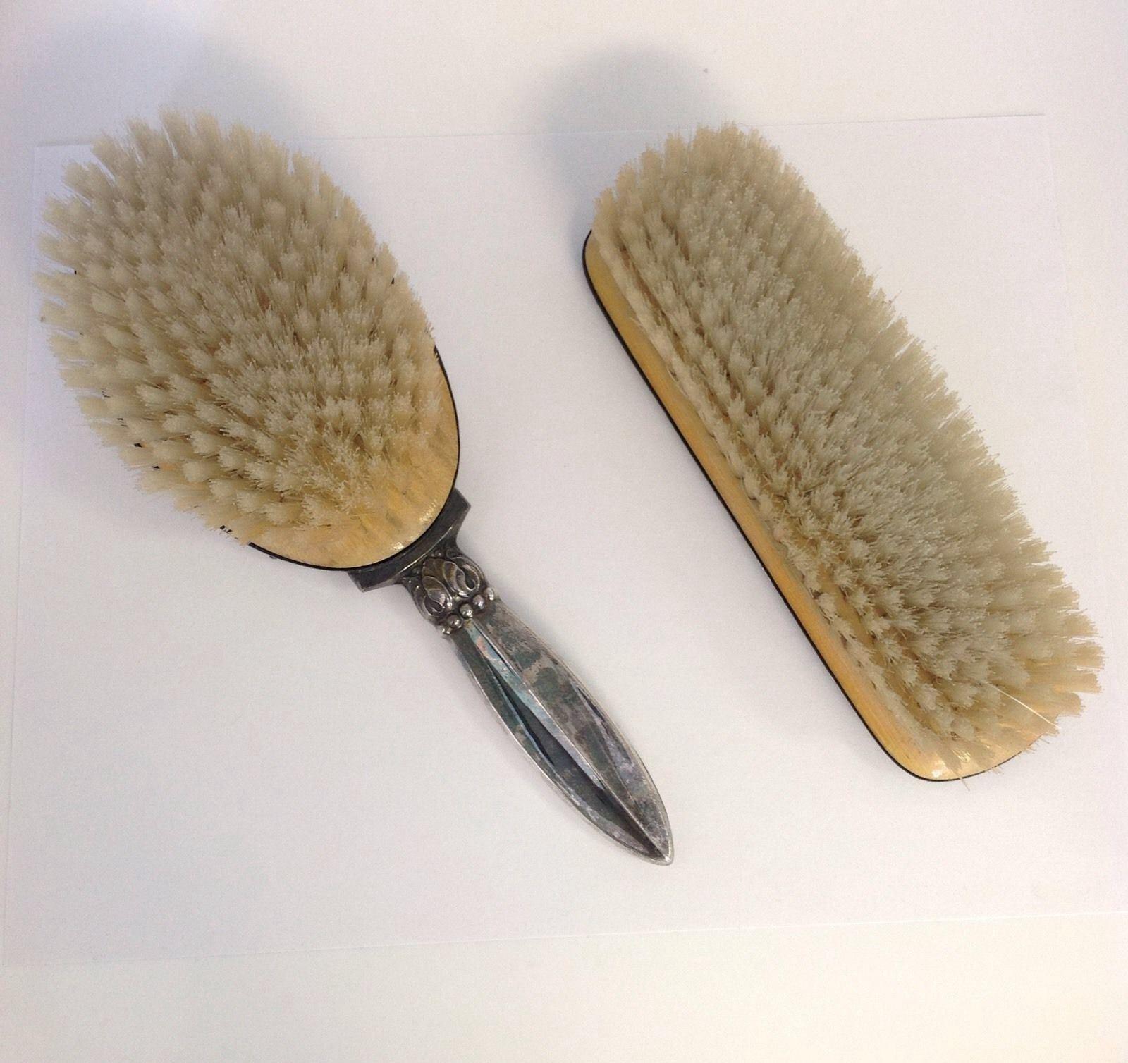 Vintage Hans Jensen Danish silver plated brush set - one hair brush and one clothes brush. 
No monogram. Marking: S & F 297 DENMARK. 
Measures: Hair brush is a total length of 8 7/8