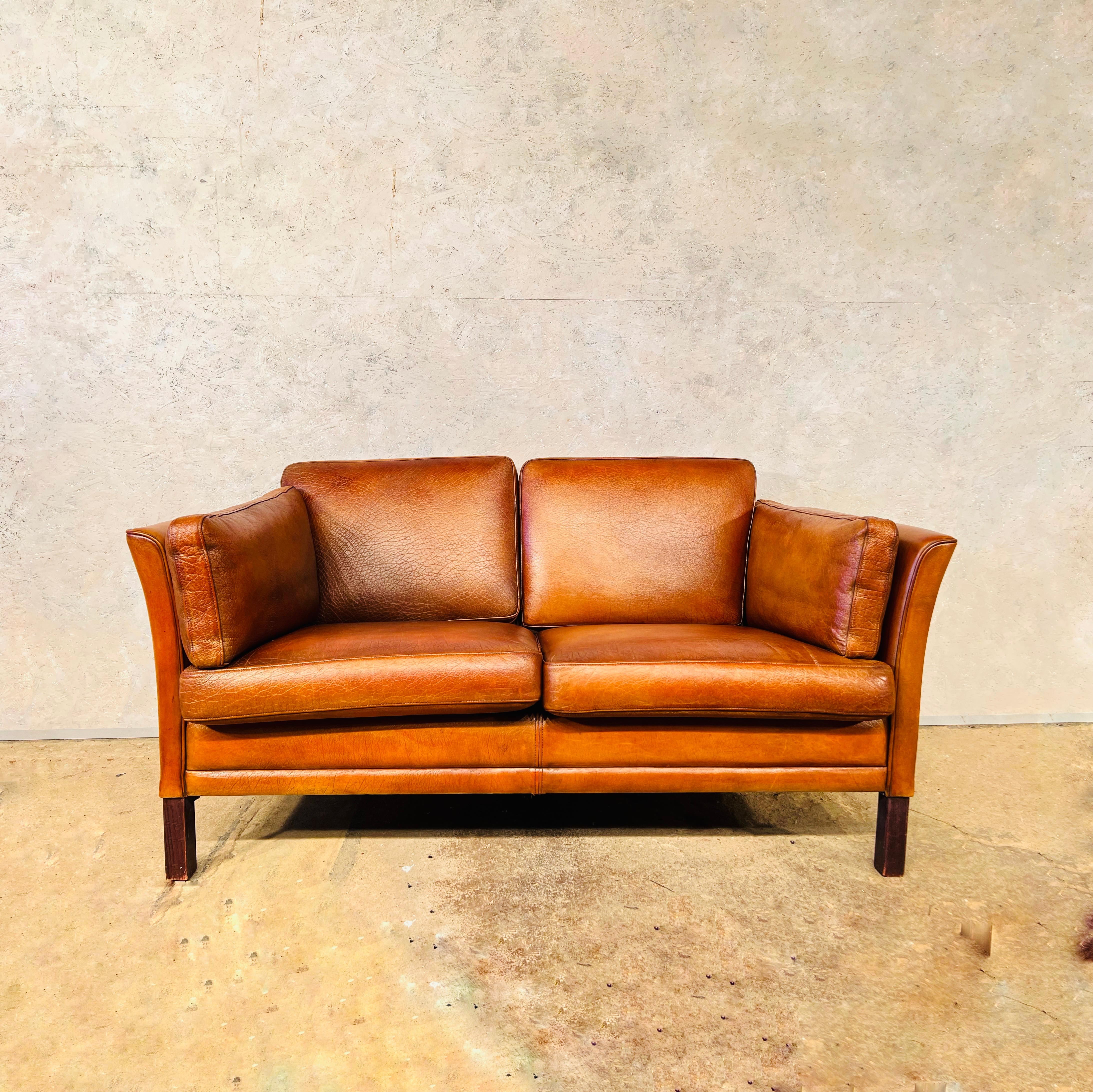 A Stylish Danish 1970s Sofa designed by Mogens Hansen, great design with beautiful lines, sits wonderfully.

Stunning hand dyed tan colour, great patina and finish.

Viewings welcome at our showroom in Lewes, East Sussex, UK.