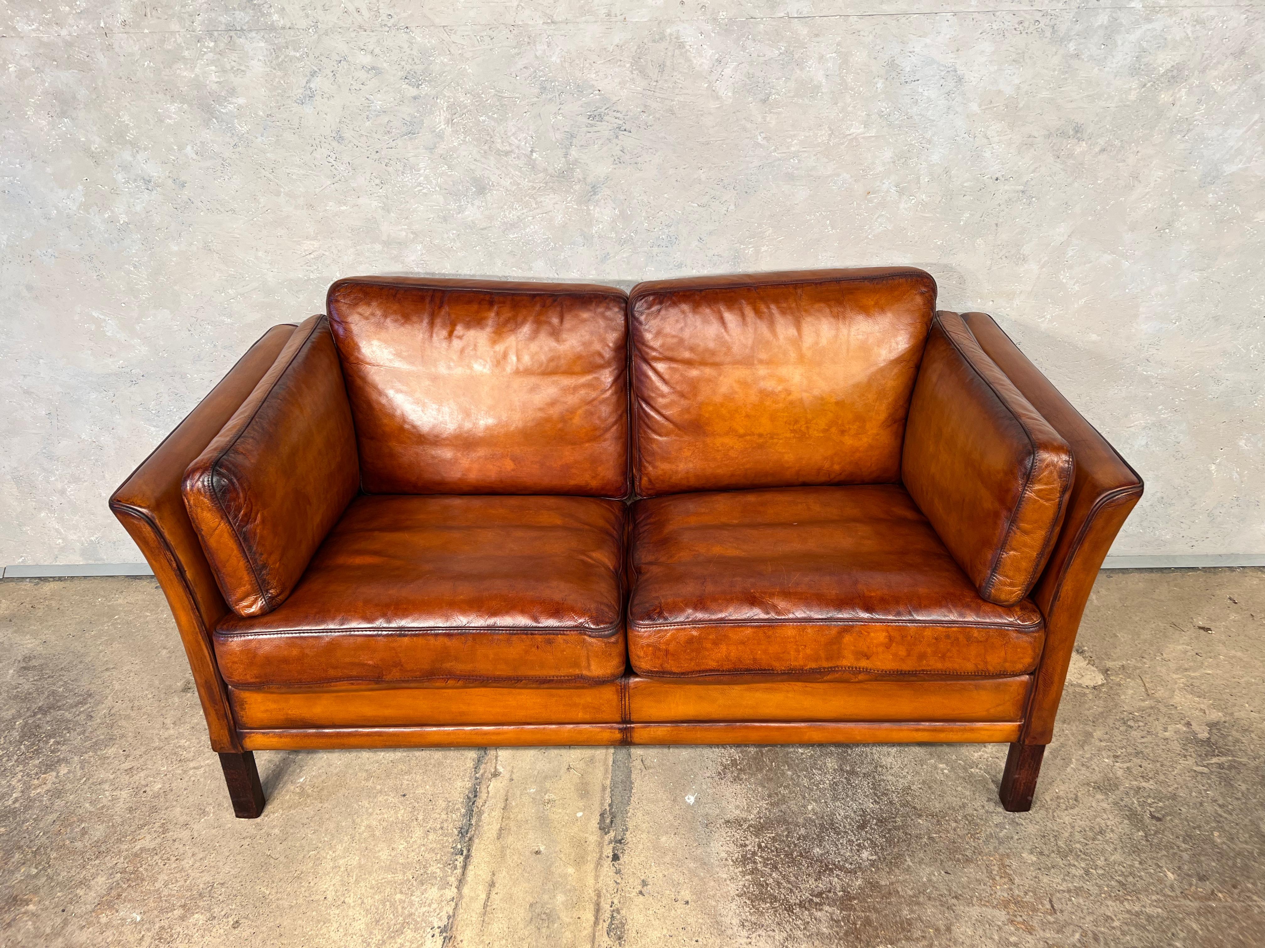 A Stylish Danish 1970s sofa designed by Mogens Hansen, great design with beautiful lines, sits wonderfully.

Stunning hand dyed tan colour, great patina and finish.

Viewings welcome at our showroom in Lewes, East Sussex.