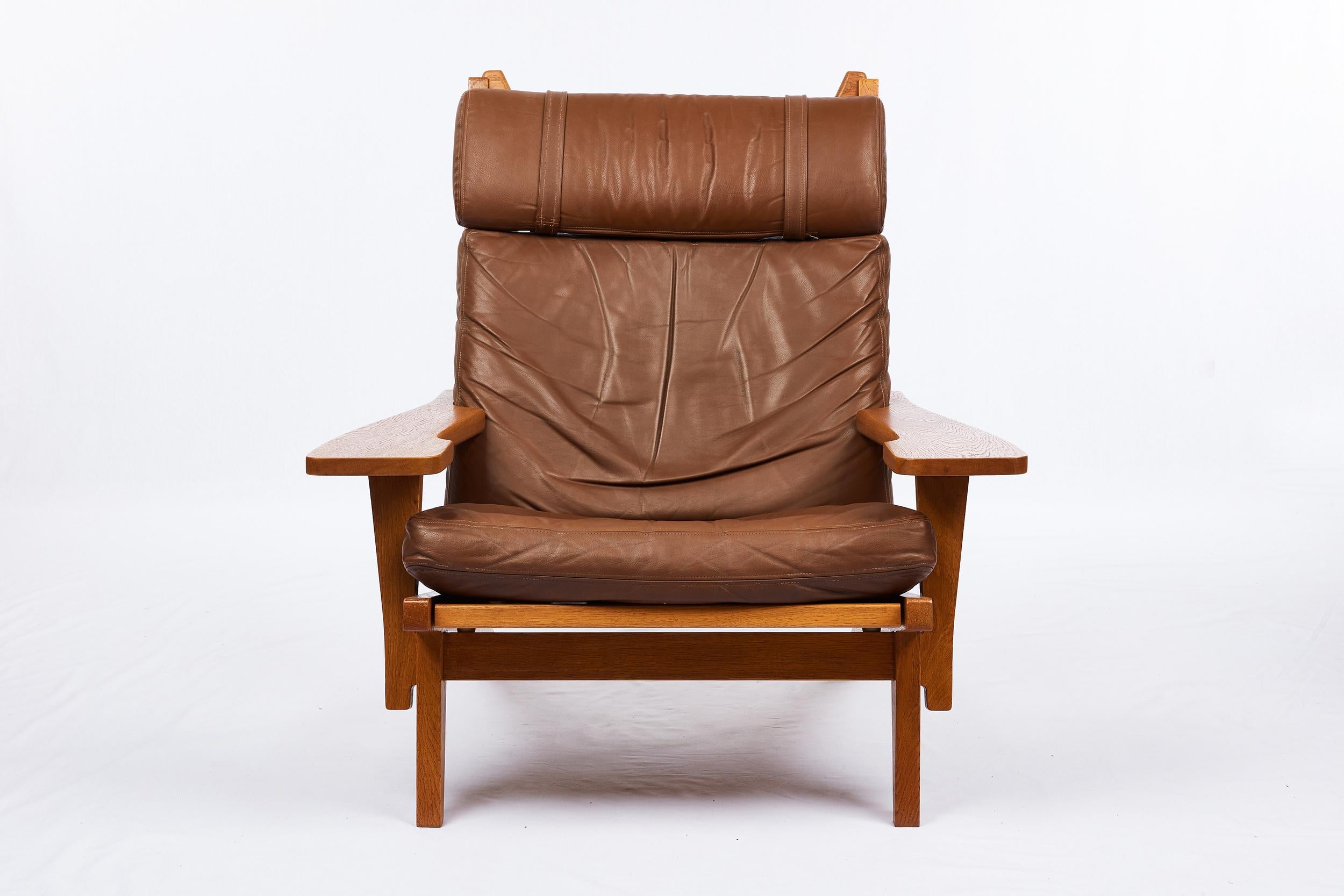 Vintage Hans Wegner GE-375 lounge chair and footstool produced by Getama. Note: We have a matched pair.
