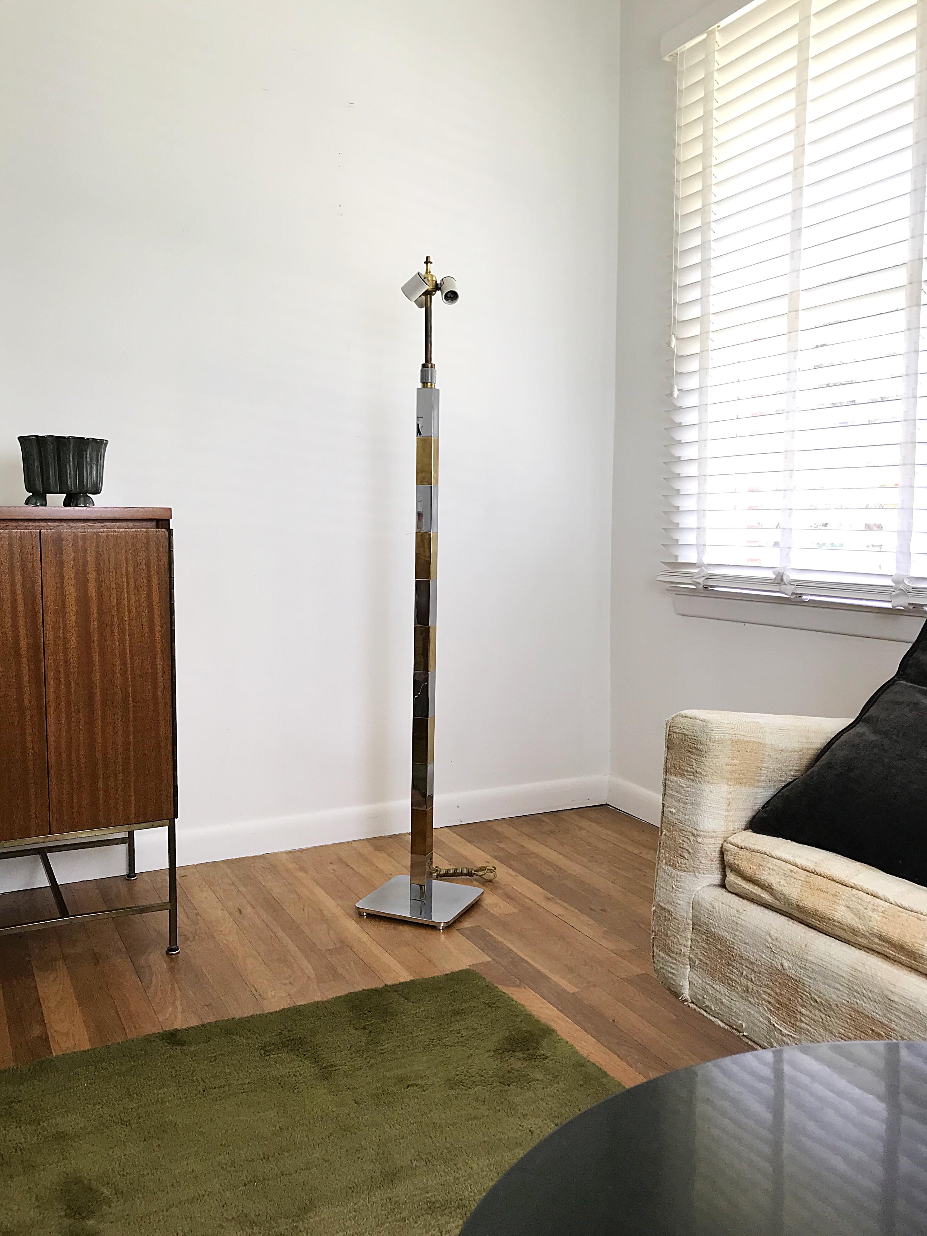 A rare brass and chrome floor lamp designed by Stewart Ross James for Hansen Lamps / New York. The floor lamp is all original and has the rare three way collar switch which is no longer produced. The lamp stands on four adjustable feet for leveling
