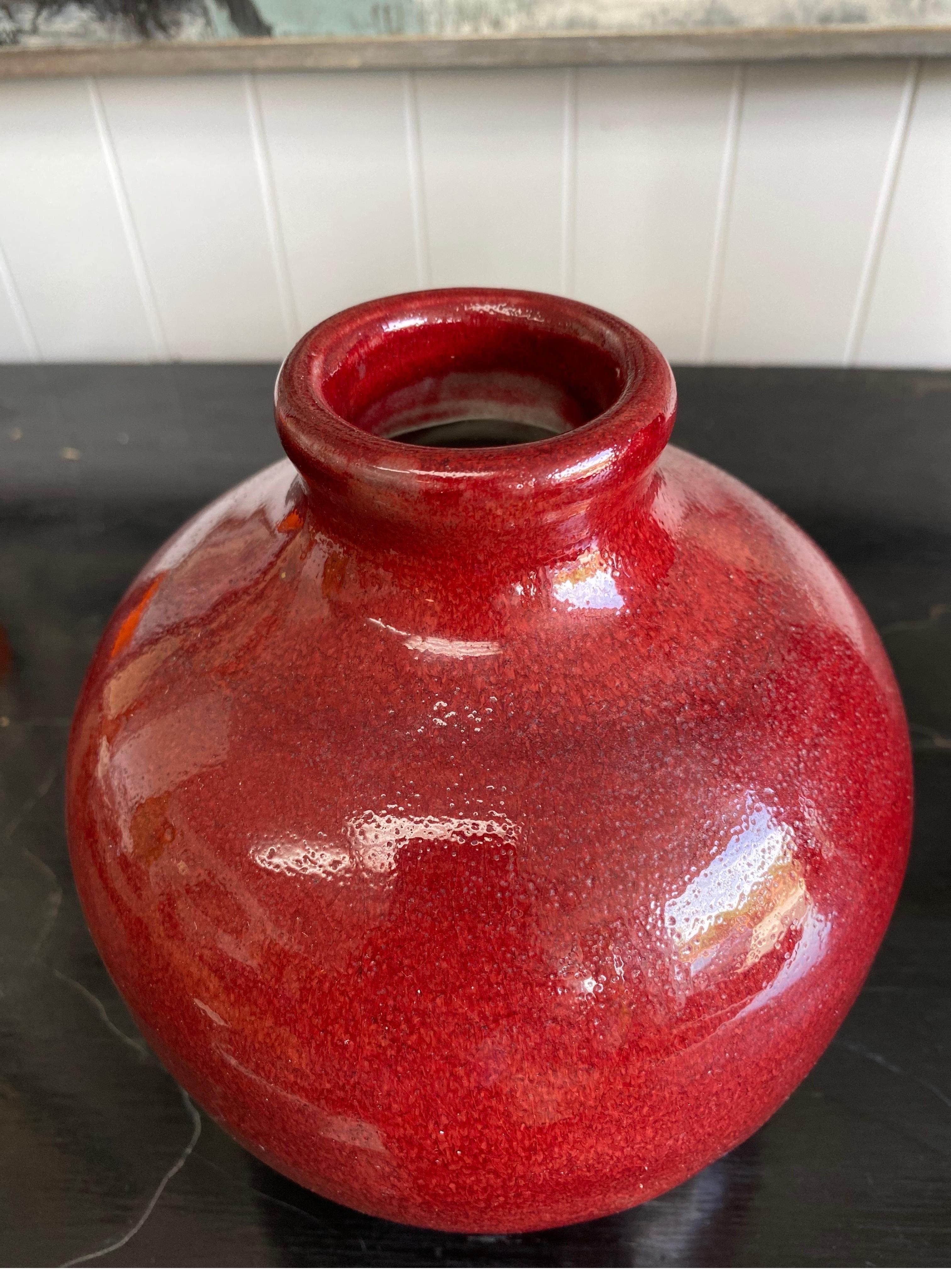 Beautiful ceramic vase by Texas ceramist Harding Black, signed and dated 1984. Self-taught Harding Black was known for his extensive glaze research and techniques. This pottery piece is a deep red. No chips and in great vintage condition.
