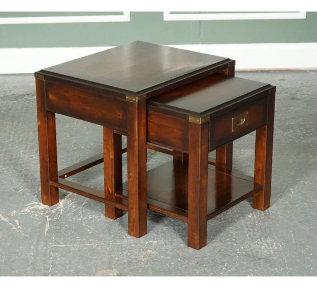 We are delighted to offer for sale this Vintage Hardwood and brass military campaign nest of tables with one drawer.

Very smart-looking nest of tables, The smaller table has a drawer for storage. We have lightly restored this by cleaning it, hand