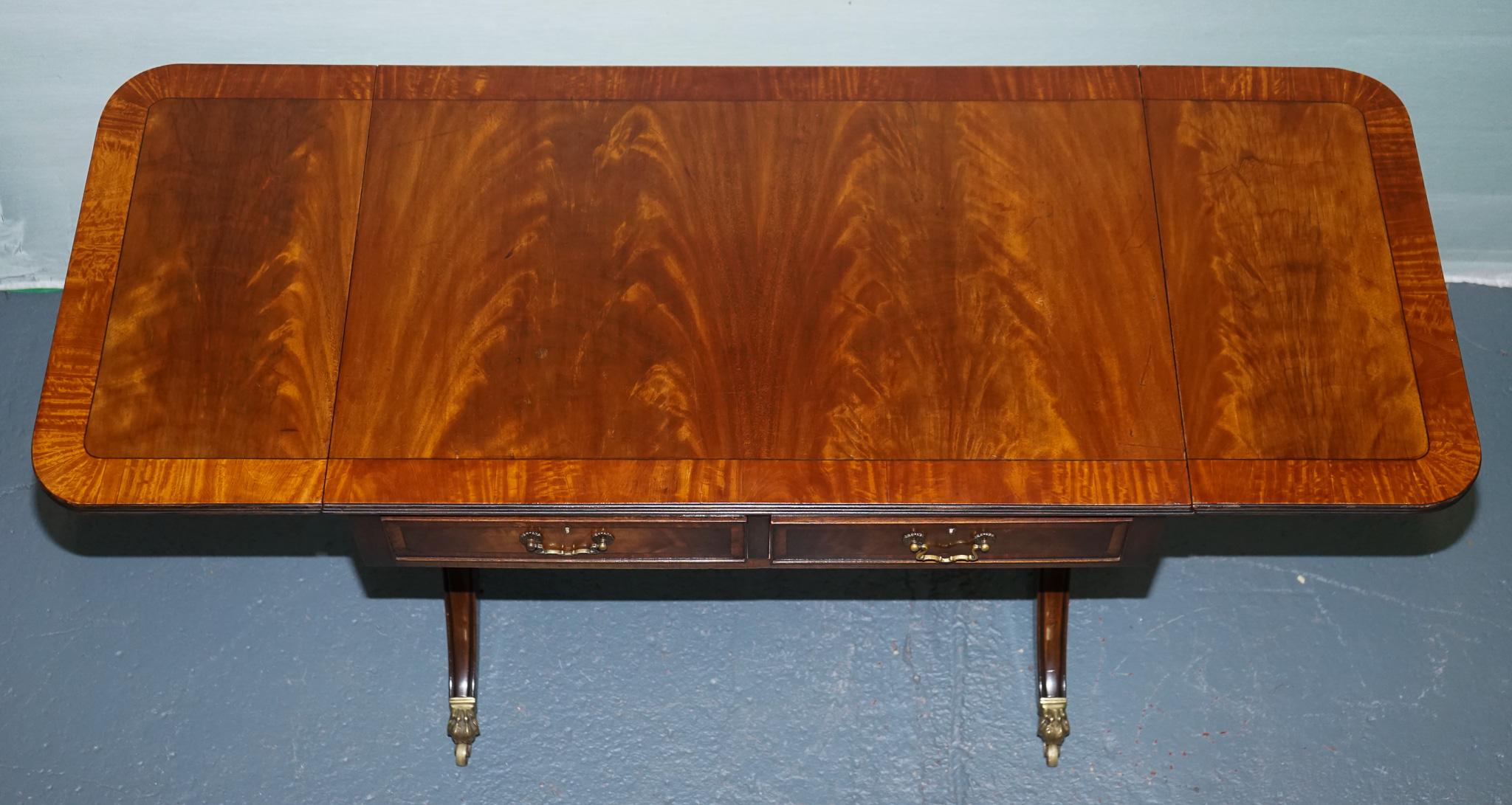 VINTAGE HARDWOOD DROP LEAF SIDE TABLE WiTH SABER LEGS AND BRASS PAW FEET For Sale 4