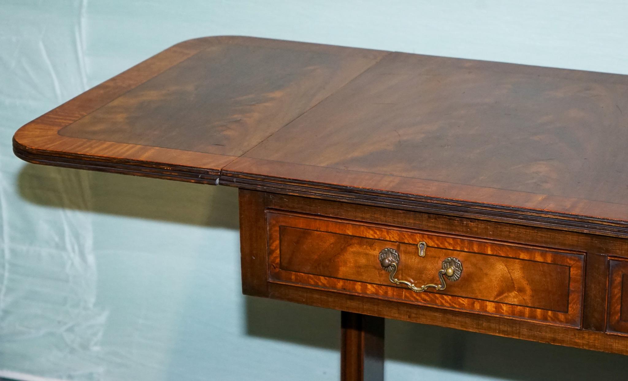 Hand-Crafted VINTAGE HARDWOOD DROP LEAF SIDE TABLE WiTH SABER LEGS AND BRASS PAW FEET For Sale