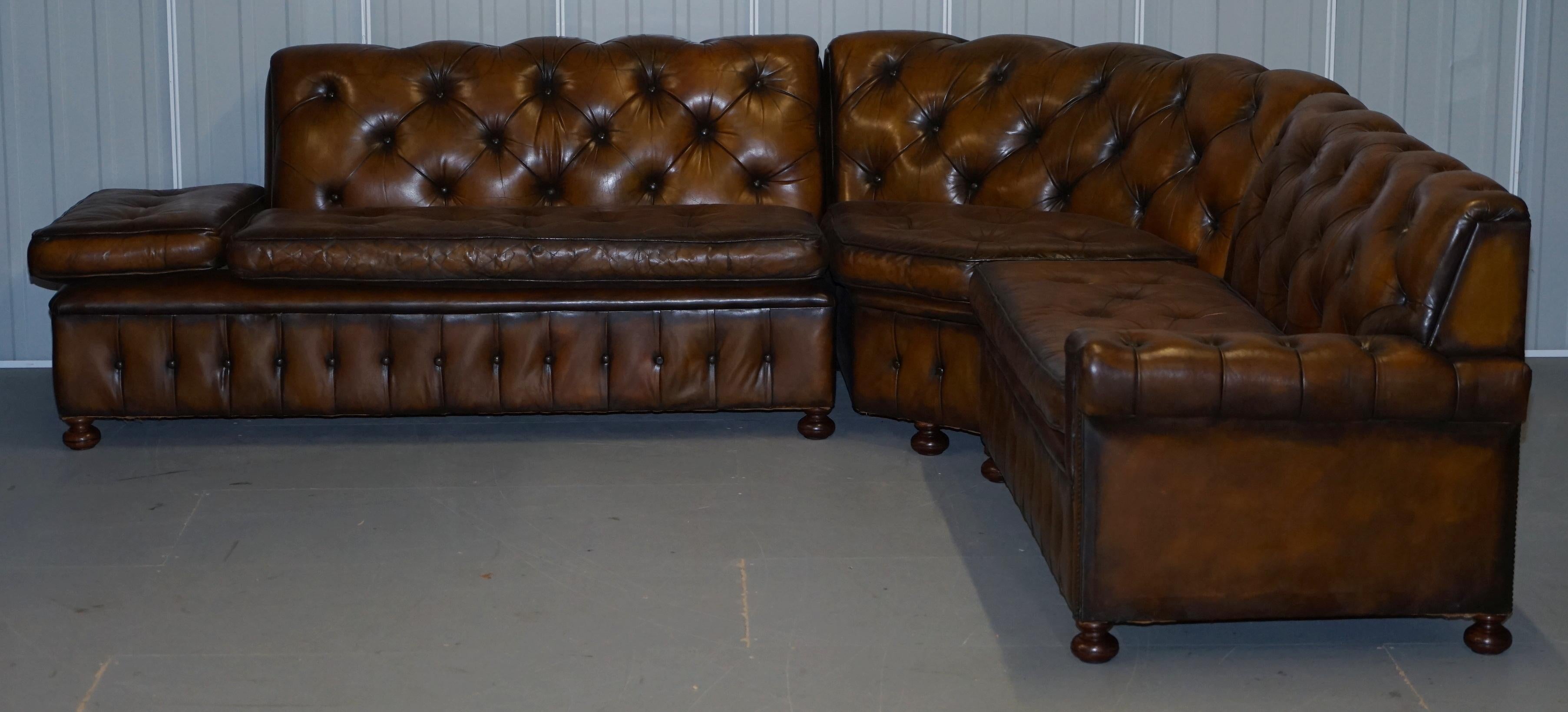 We are delighted to offer for sale this stunning custom made to order vintage fully restored hand dyed cigar brown leather Chesterfield corner sofa with solid hand turned walnut bun feet

A very rare sofa, this is a vintage piece bought from