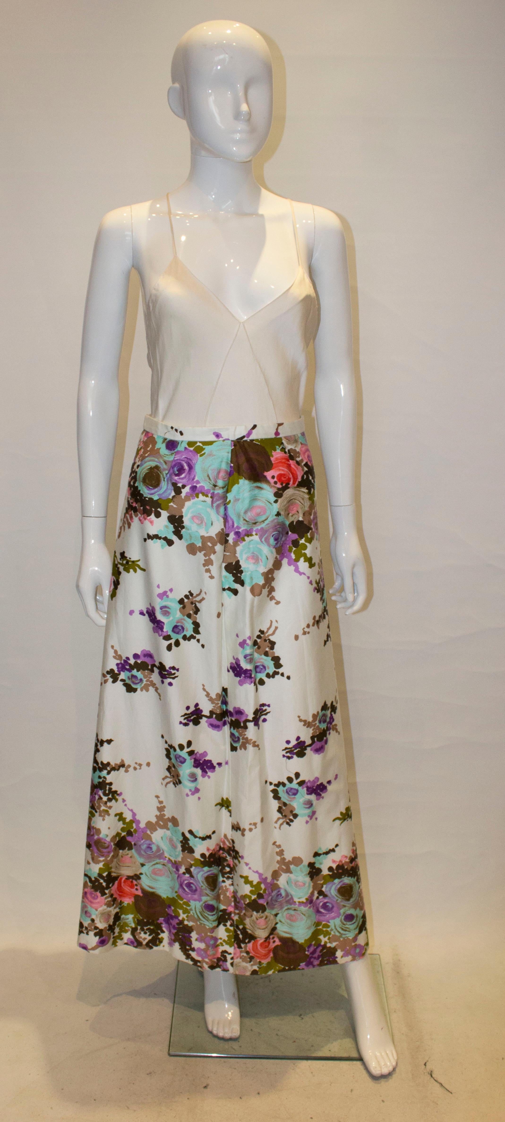 A lovely skirt for a Spring /Summer evening.  The skirt is in a floral cotton  print , with a zip opening on the left hand side. It is fully lined.