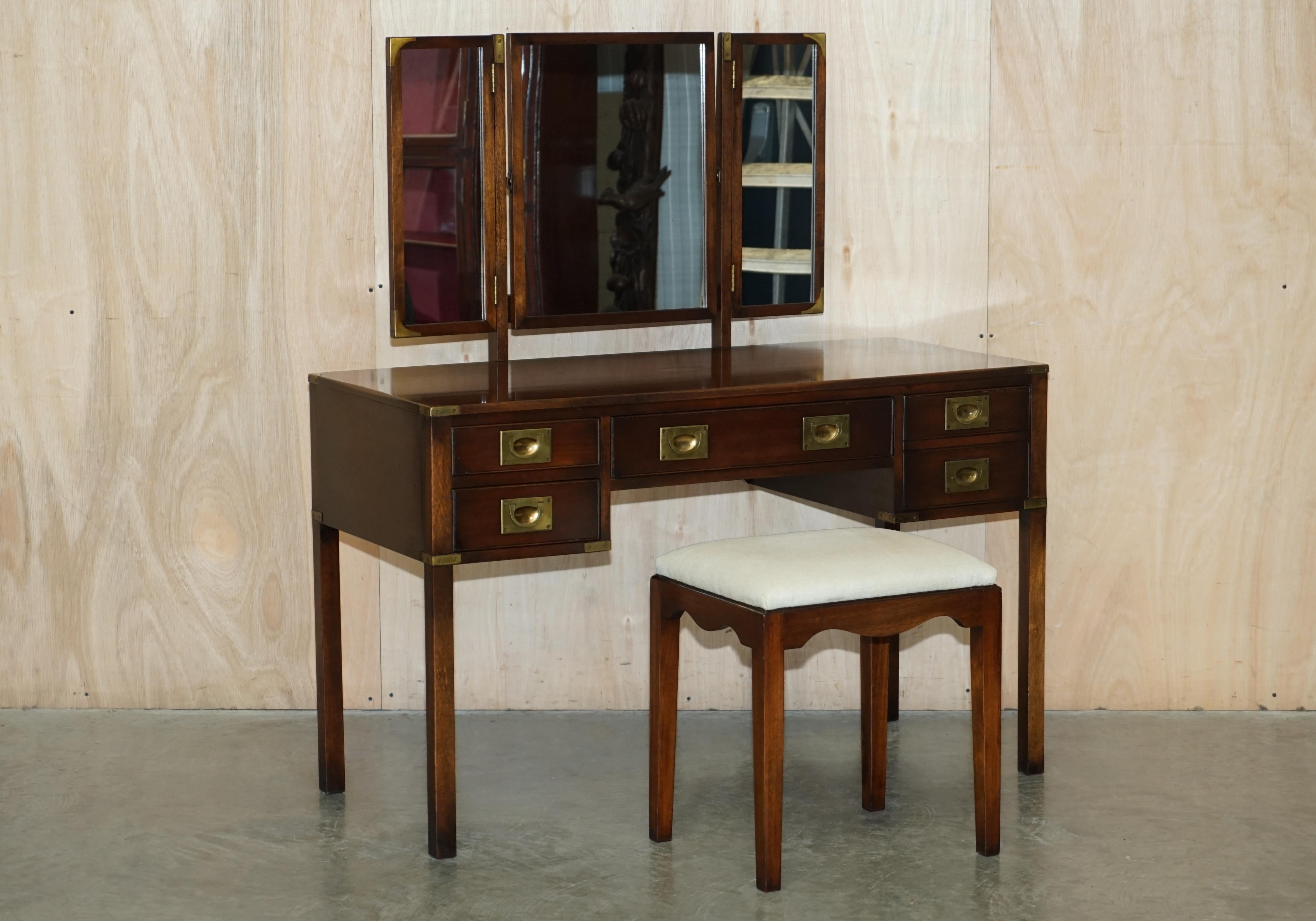 We are delighted to offer for sale this super rare, hand made in England, solid mahogany Harrods London retailed, REH Kennedy made, dressing table with trifold mirror and stool

I have never seen another campaign dressing table in all my time of