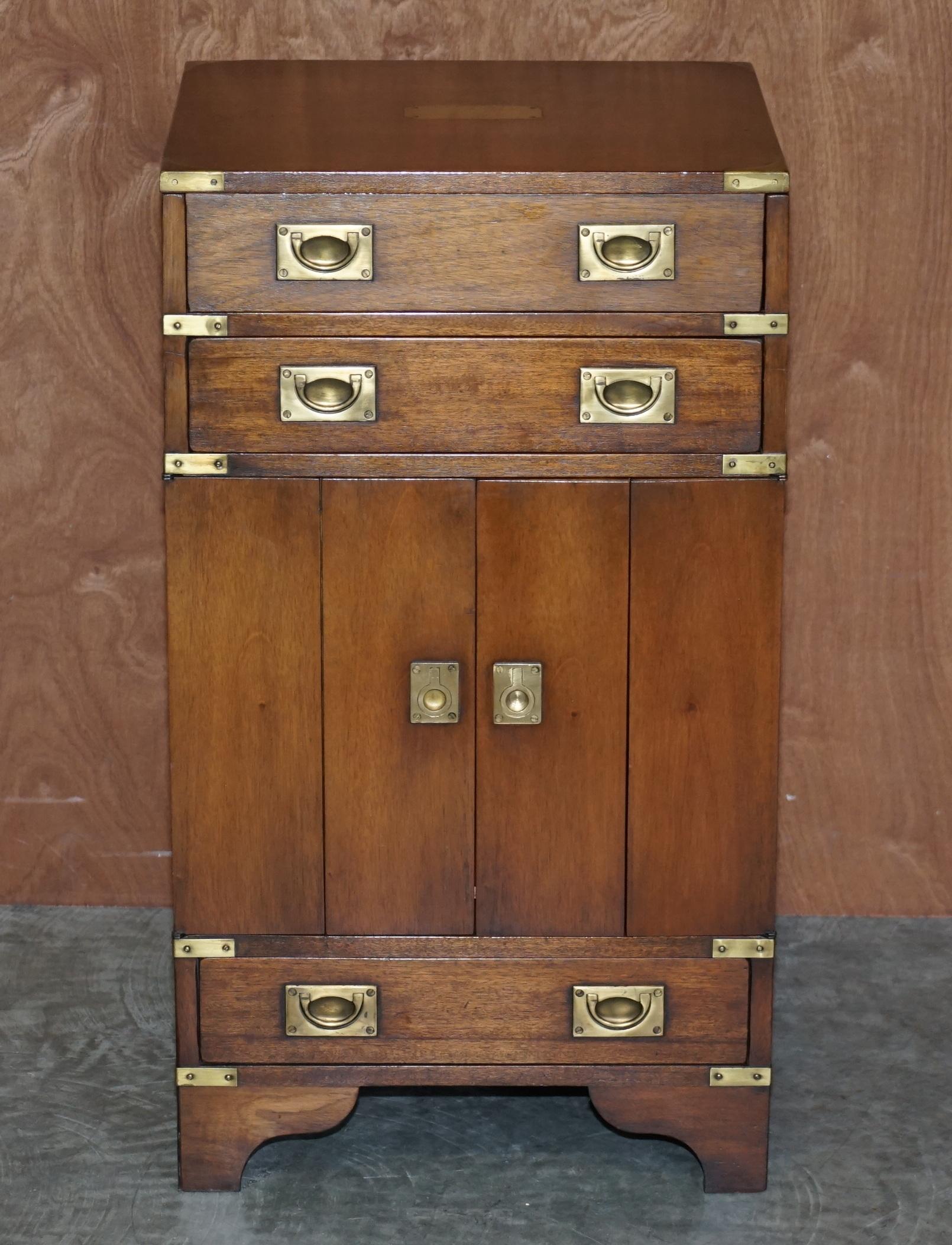 We are delighted to offer for sale this original Harrods London R.E.H Kennedy Furniture Record Player cupboard in solid mahogany with brass detailing made in the Military Campaign style 

A very well made and decorative piece of metamorphic