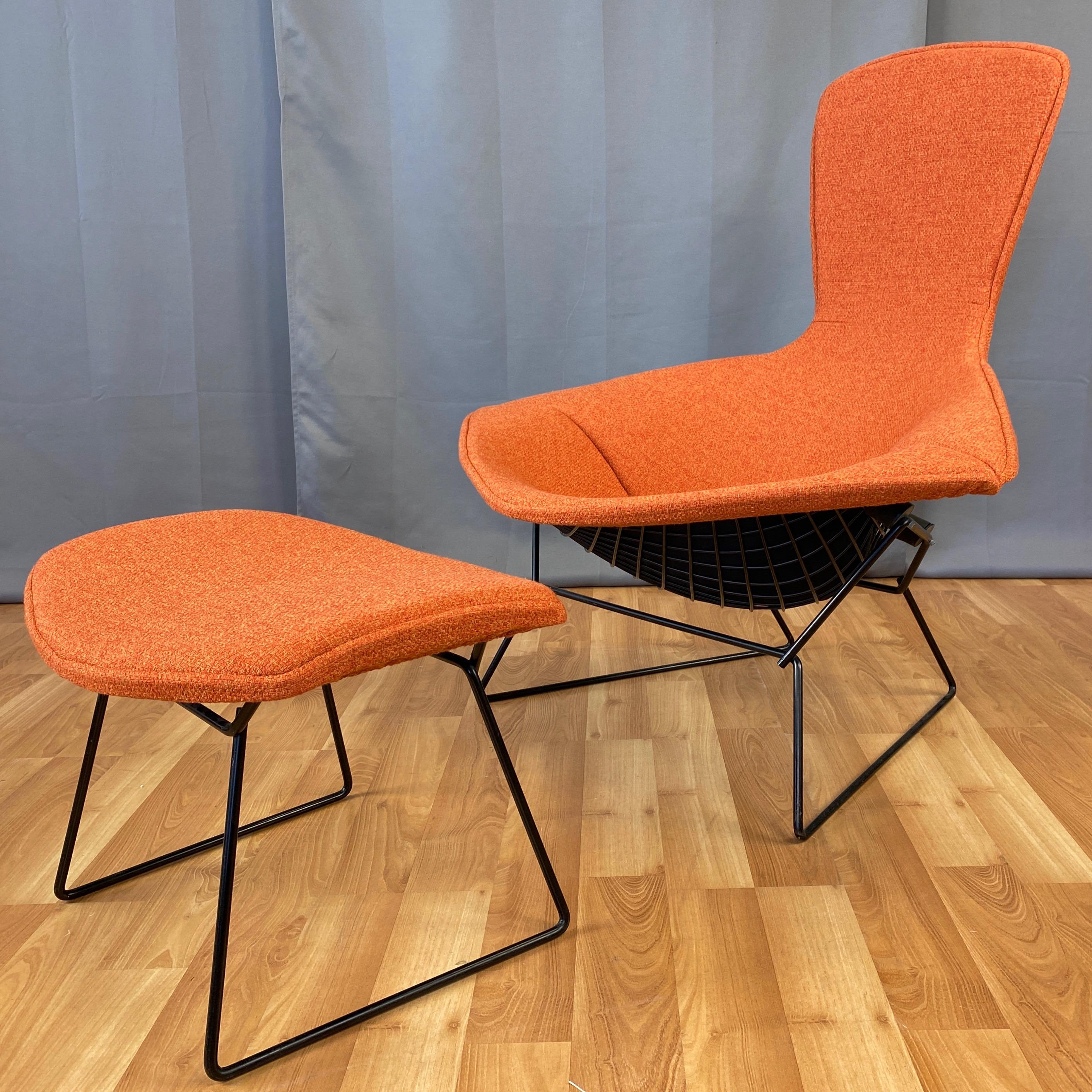 A 1980s Bird chair and ottoman by Harry Bertoia for Knoll with black frames and new two-tone orange upholstery covers.

Designed by Bertoia as part of his 1952 collection for Knoll, the Bird chair’s sculptural form, distinctive silhouette, and