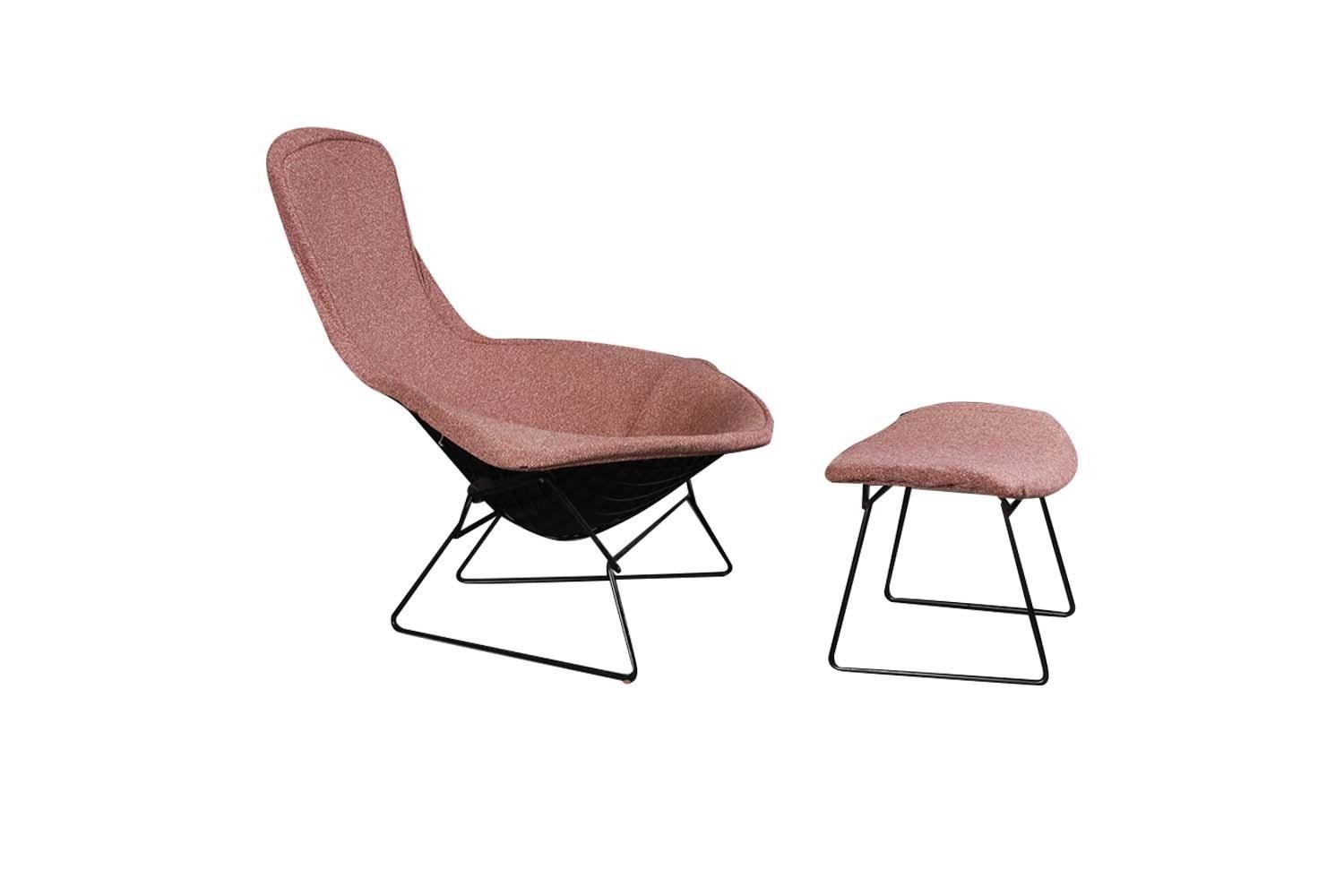 A beautiful Mid-Century Modern, stylish high back, bird lounge chair and ottoman designed by Harry Bertoia circa 1960s for Knoll. Features a stunning profile, with stylish wing-like arms, high back sculptural form, black enameled welded steel rod