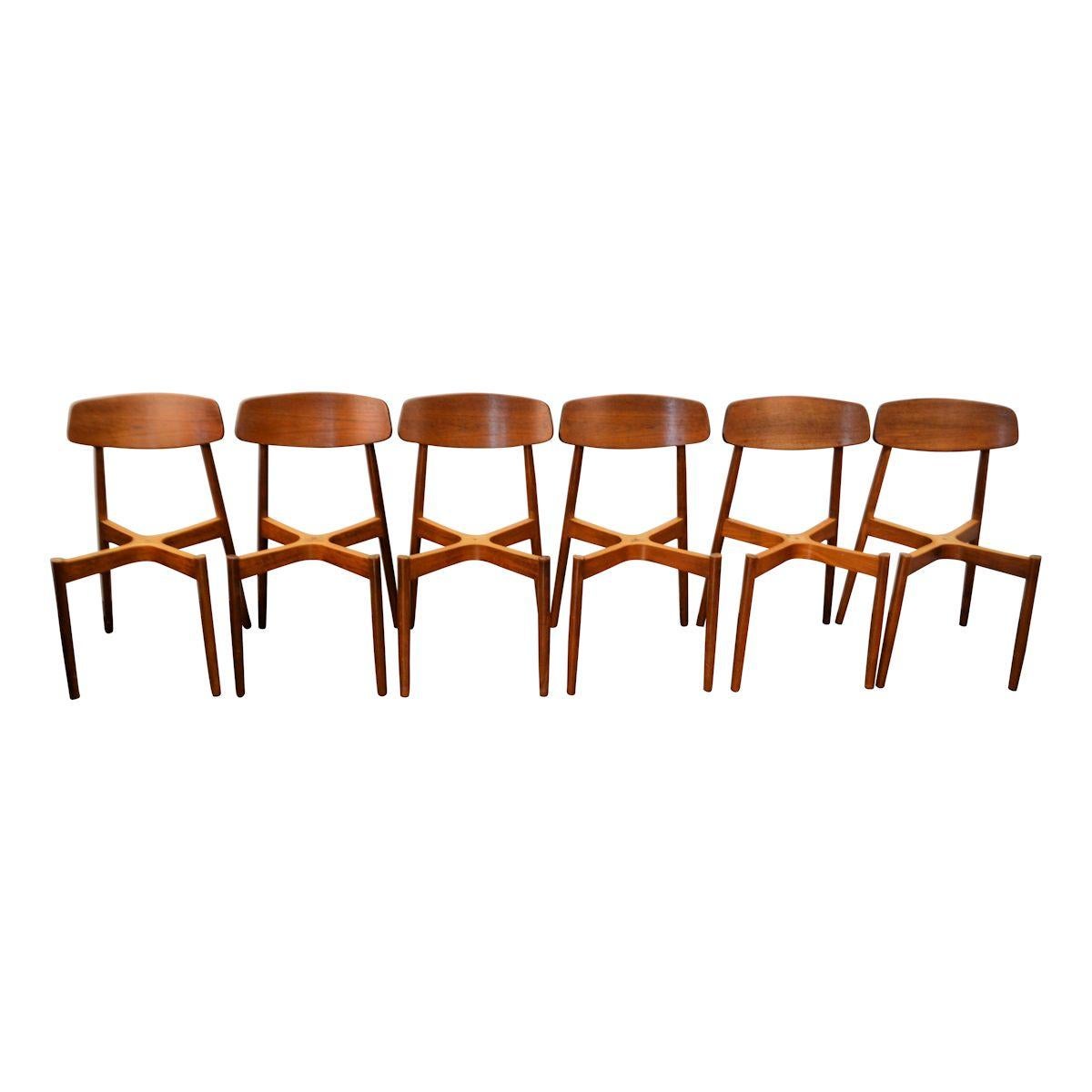 Set of six vintage dining chairs designed by Harry Østergaard for Randers Møbelfabrik. These high-end design pieces feature solid teak frames and backrests. A typical midcentury Danish design which provides an excellent seating comfort. We have