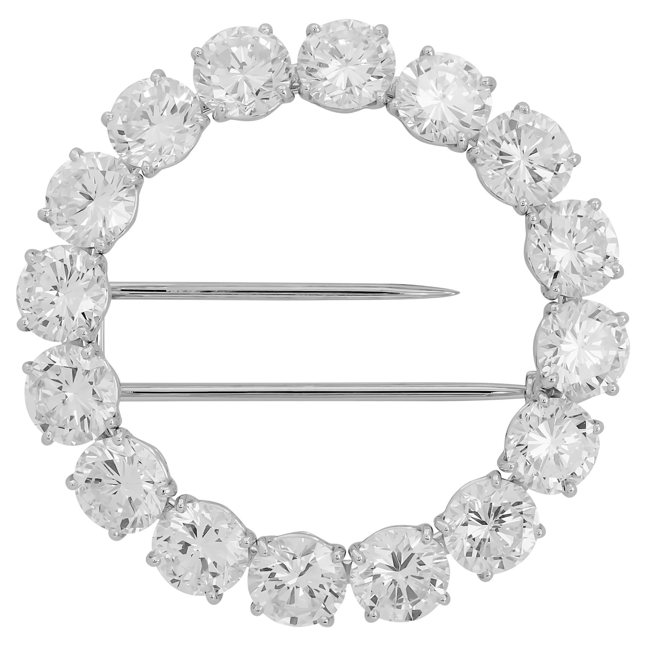 This elegant Harry Winston brooch pin features a continuous circle of dazzling, individually set round brilliant-cut diamonds in platinum, embodying timeless sophistication and exceptional sparkle.

16 round diamonds ~11.31 carats; D-E-F color and