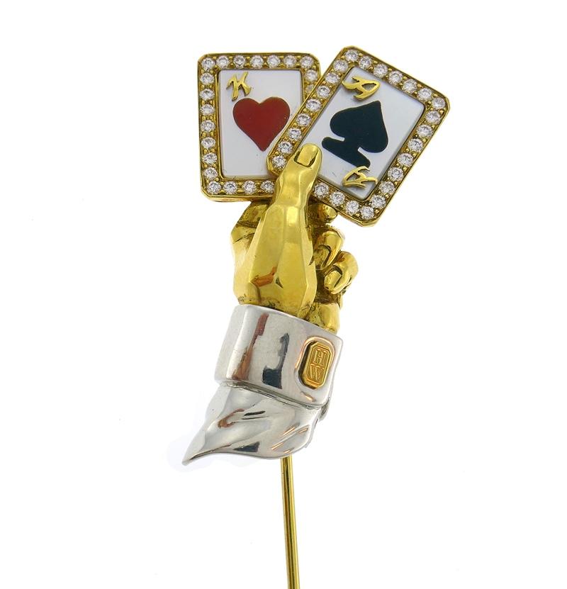 Fun and extravagant cards  pin created by Harry Winston in the 1980s. 
Made of 18 karat (stamped) yellow and white gold, mother-of-pearl, black onyx, coral and accented with round brilliant cut diamonds (F-G color, VS1 clarity, 0.23 carat total