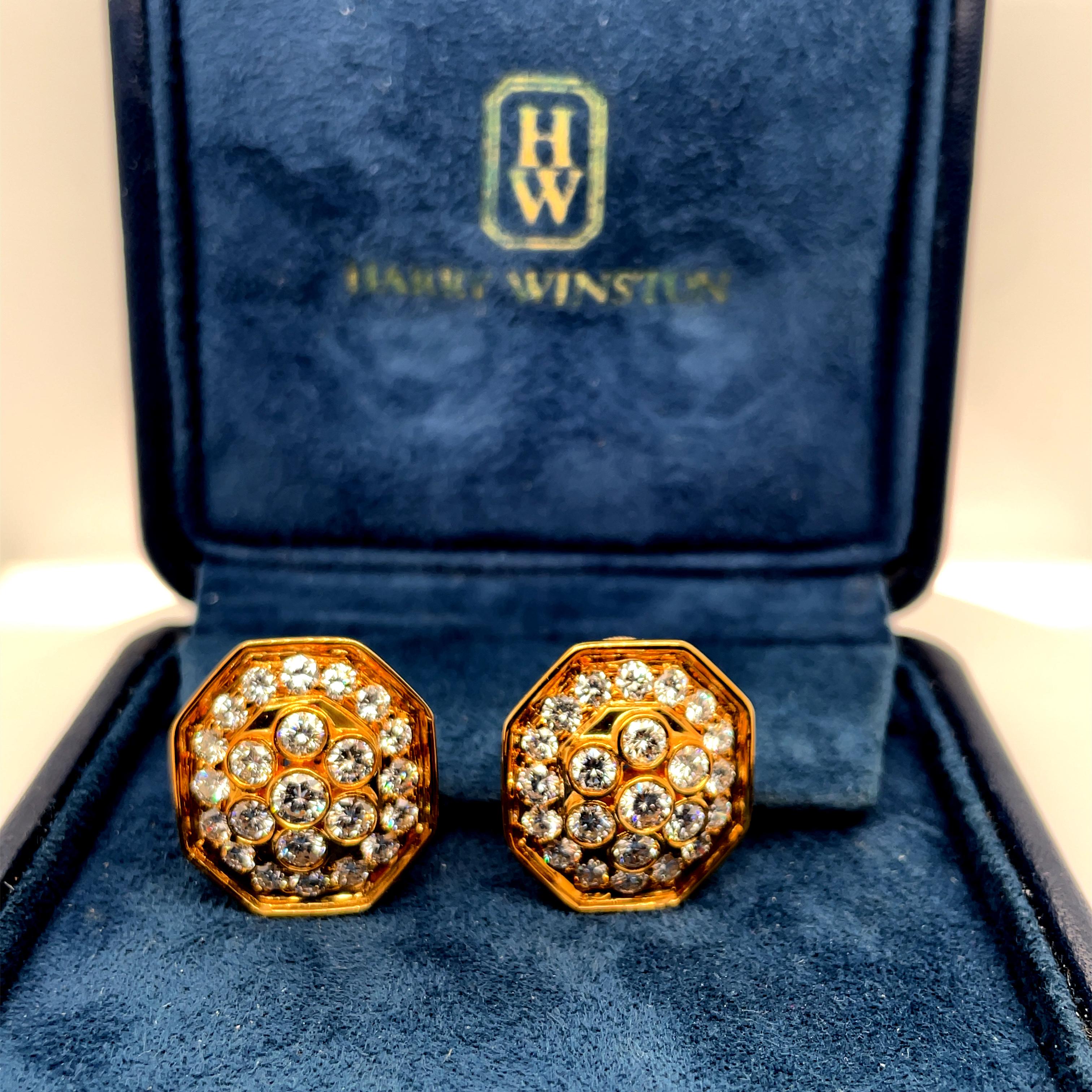 Beautiful Harry Winston luscious yellow gold with cluster of colorless diamond earrings in its own original box. The earrings have clip back and are crafted in 18K yellow gold. Stamped 750 Winston. The measurement is 7/8 inch wide by 1 inch long.