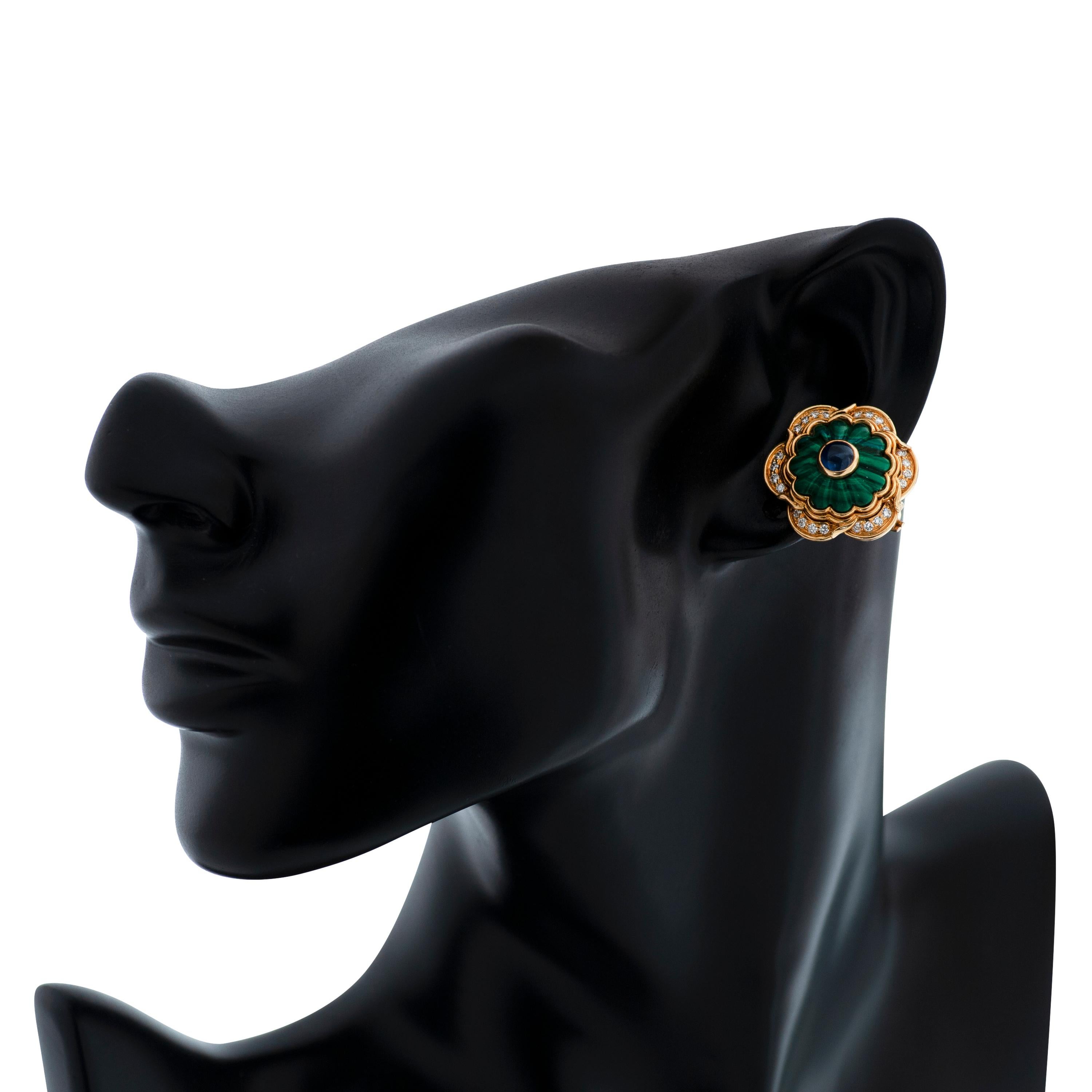 Vintage Harry Winston diamond, sapphire and carved malachite earrings in 18k yellow gold.  

This pair of Harry Winston earrings feature 48 round brilliant cut diamonds totaling approximately 0.72 carat with F-G color and VS clarity as well as 2