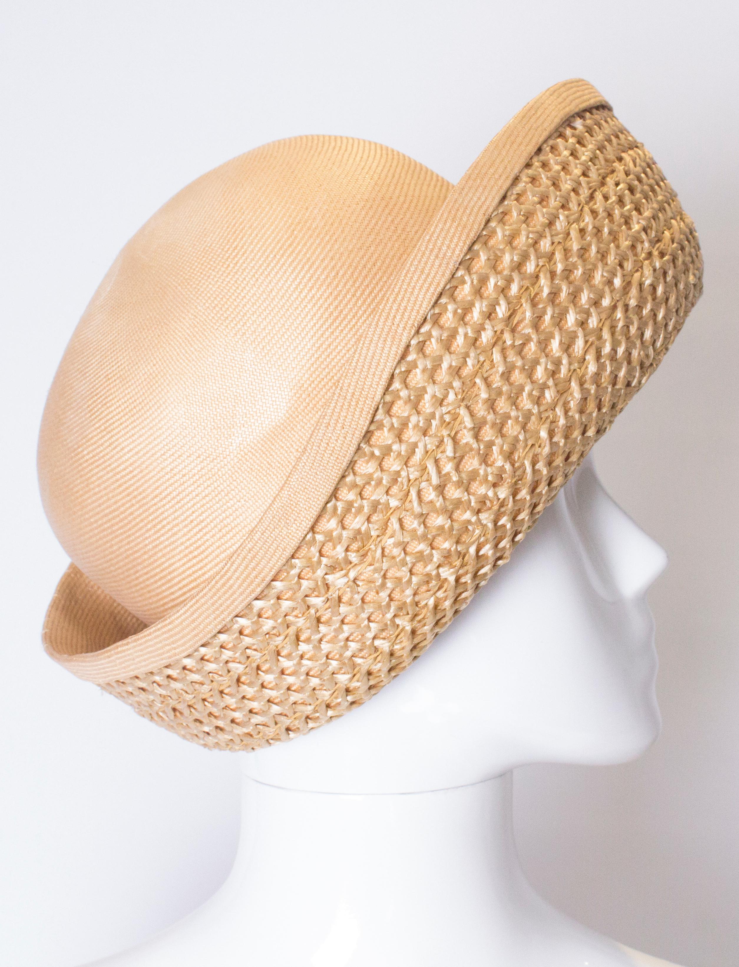 A head turning vintage hat by Harvey Nichols. The hat has a upturned brim in a woven style.
Inner circumference 24''
