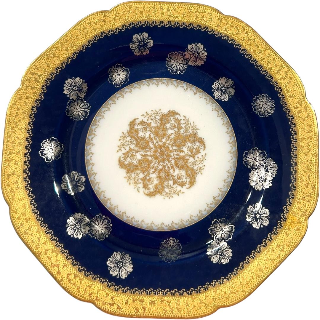 This set of 11 Haviland Limoges dinner plates boasts a stunning cobalt blue color with delicate gold accents.  Made from fine bone china, each plate is hand painted and bears the vintage charm of their origin in France.  Perfect for any occasion,