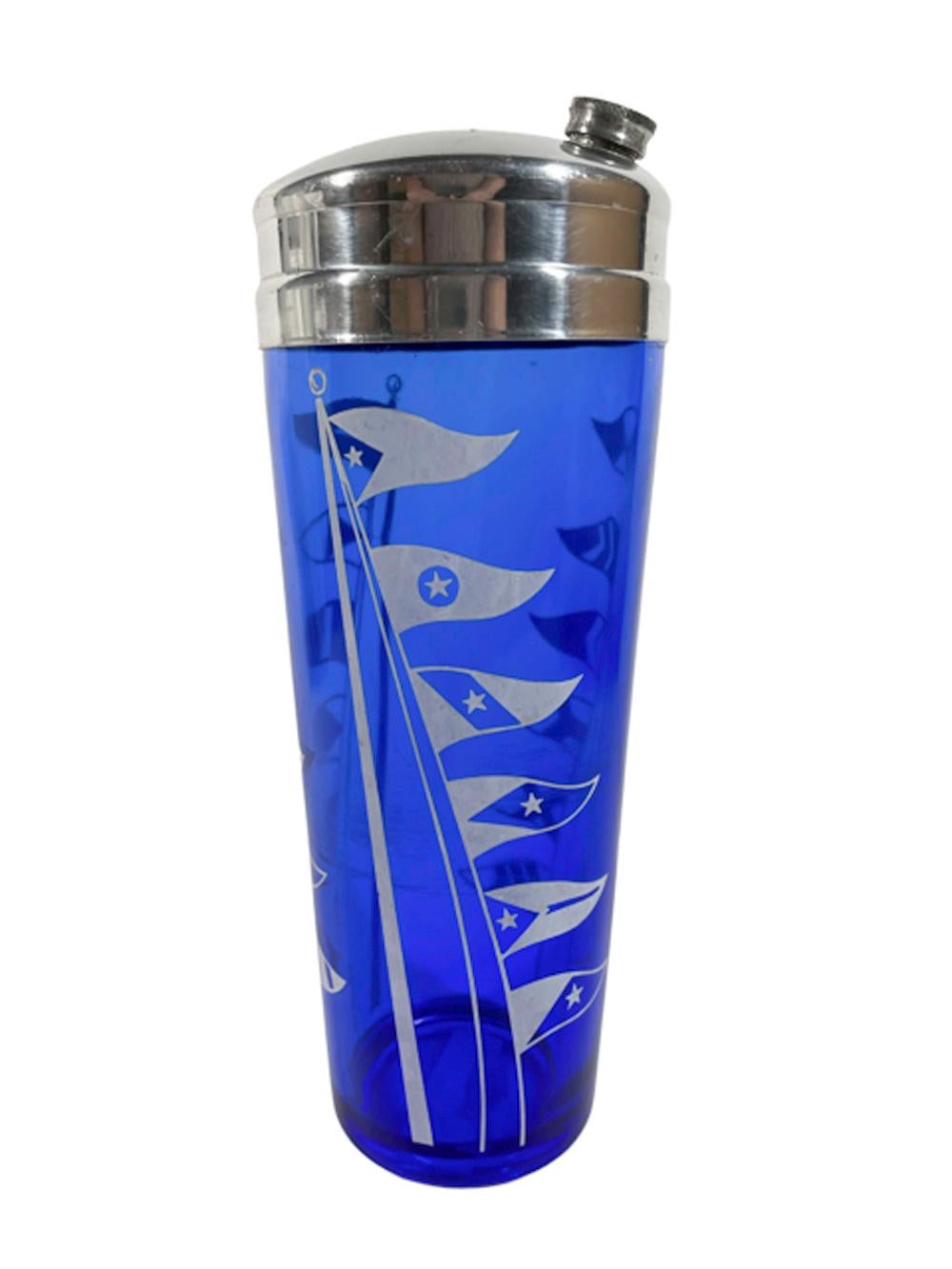 Art Deco cobalt glass cocktail shaker from the Sportsman Series decorated with white nautical signal flags on a pole. The glass shaker is topped with a chrome lid with a threaded cap on the pour spout and integral strainer.