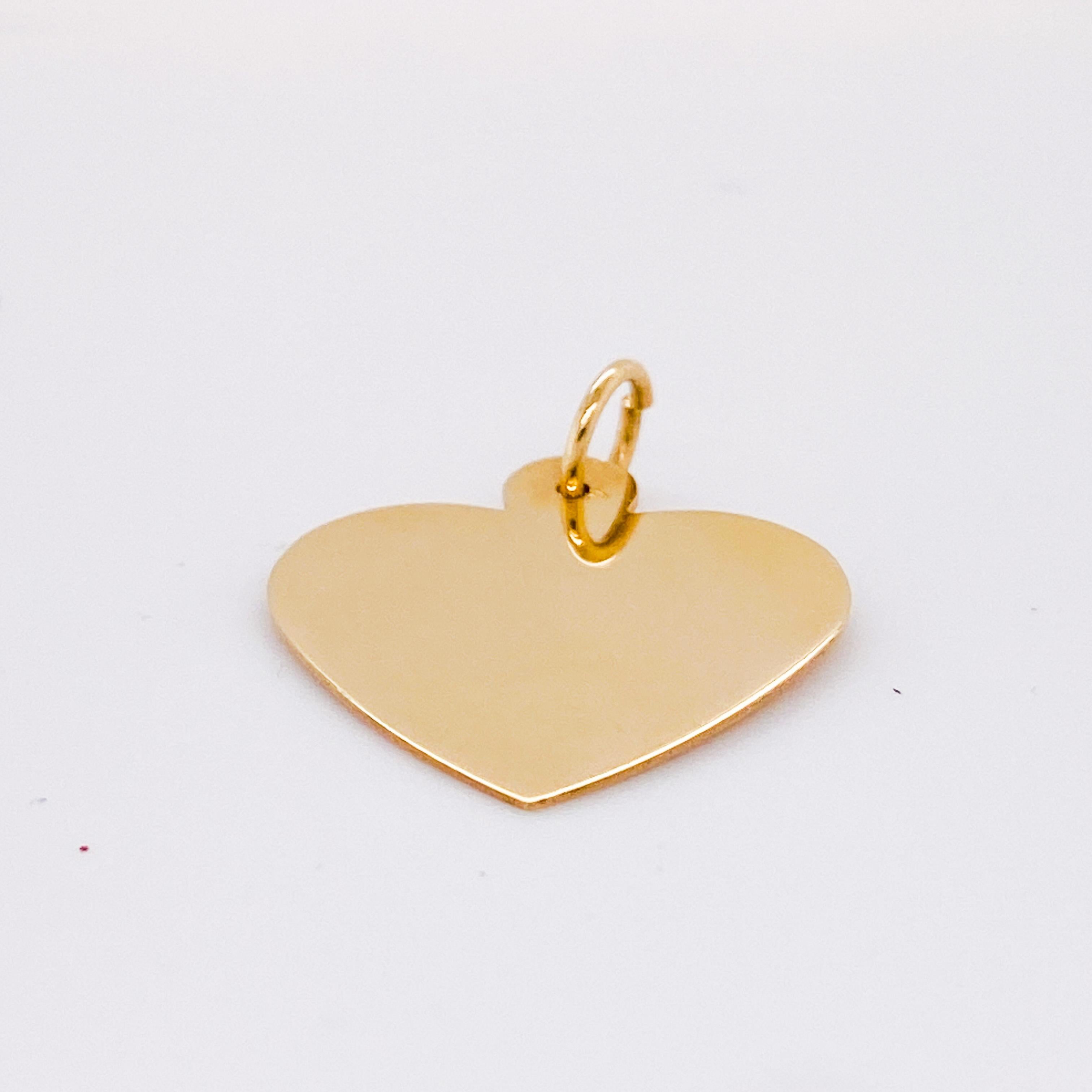 This beautifully preserved vintage heart disk is ready to grace your favorite chain or charm bracelet. The flat disk of the heart can create a perfect stack with other pendants or hearts! If you know an engraver, both sides can be engraved! The