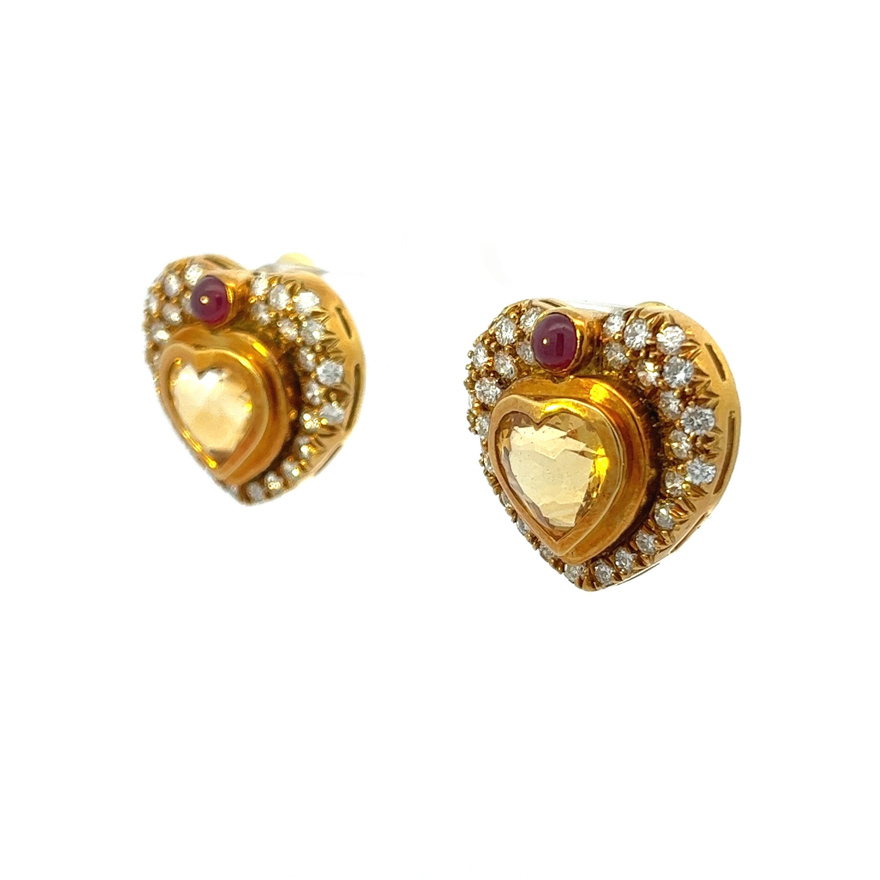 18k classic vintage heart earrings with G H color and VS diamonds totaling 1.86ctw. In the center of the piece sits beautiful honey colored heart shape citrine stones totaling approximately 4.04ctw between the two stones. The cherry on top is the