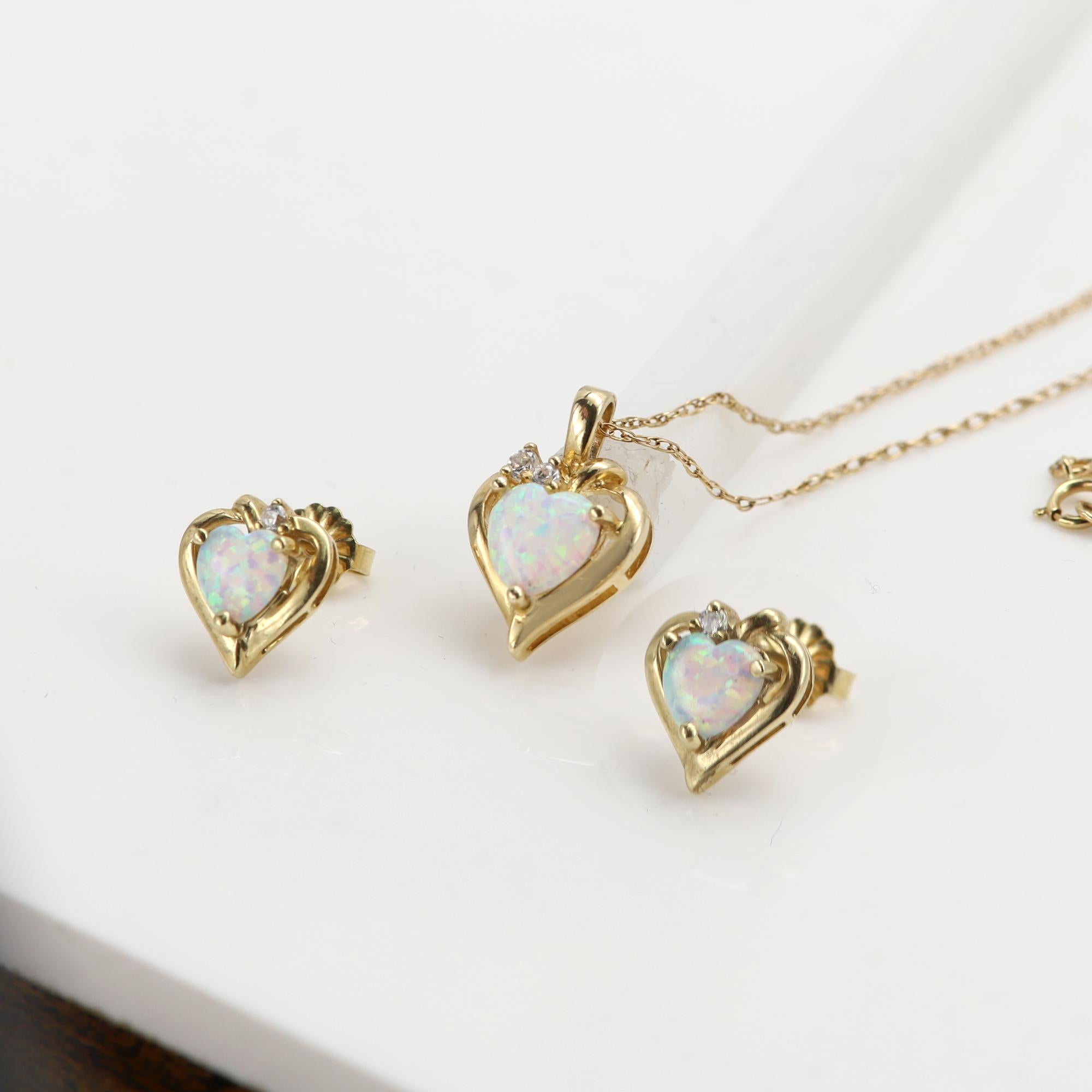Vintage Opal Pendant+ Earring set
Cute Size 
10k Yellow Gold
Pre-owned as new condition
Natural real opal
approx weight: 3.80 grams(both)
Pendant size: 12mm (opal size 8mm)
Earring size: 10mm (opal size 6mm)
Chain 18' inch basic link chain
Few small