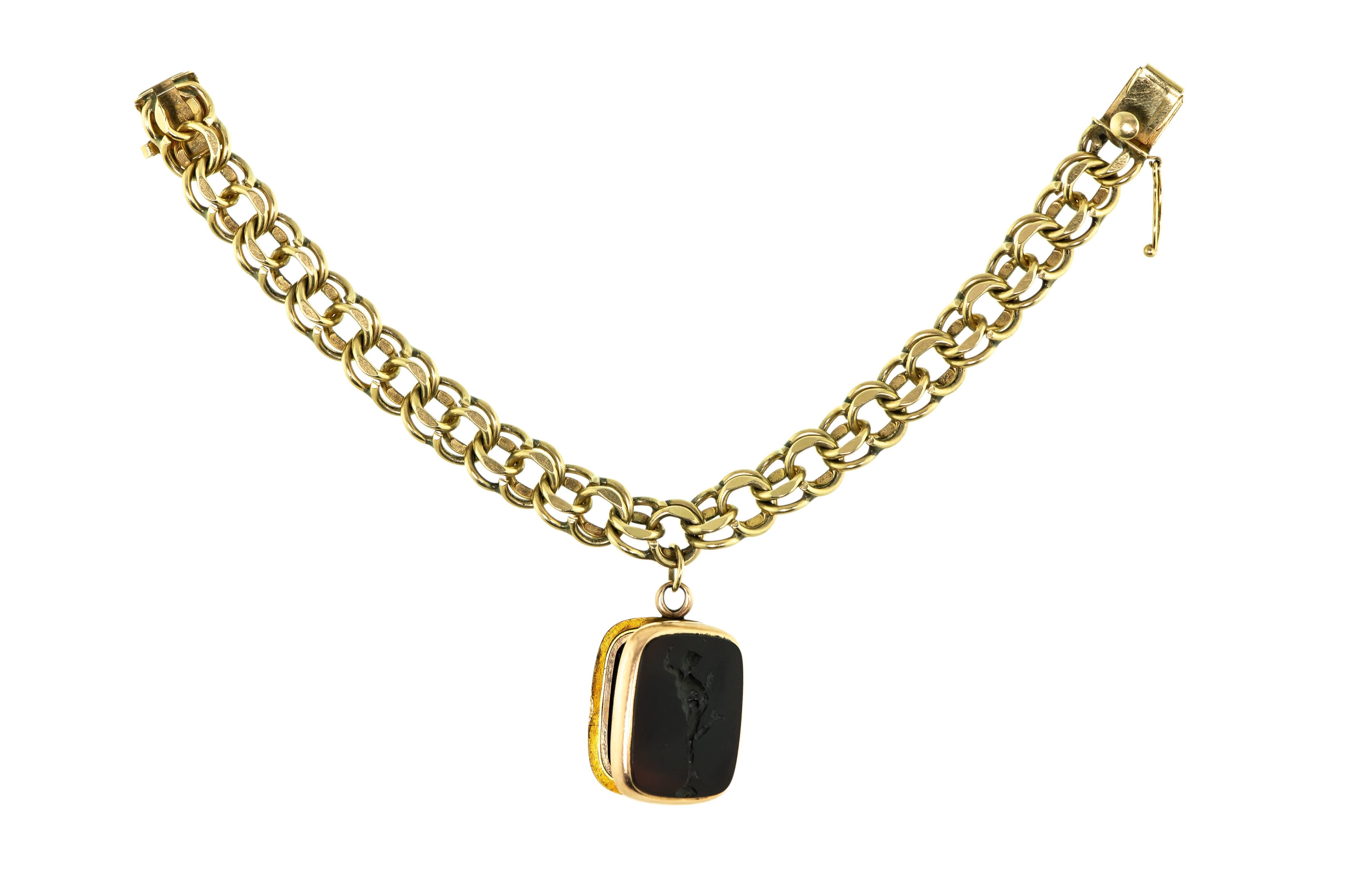 Vintage Heavy 14 Karat Flexible Bracelet with Antique Hardstone Intaglio Locket In Excellent Condition For Sale In Lombard, IL