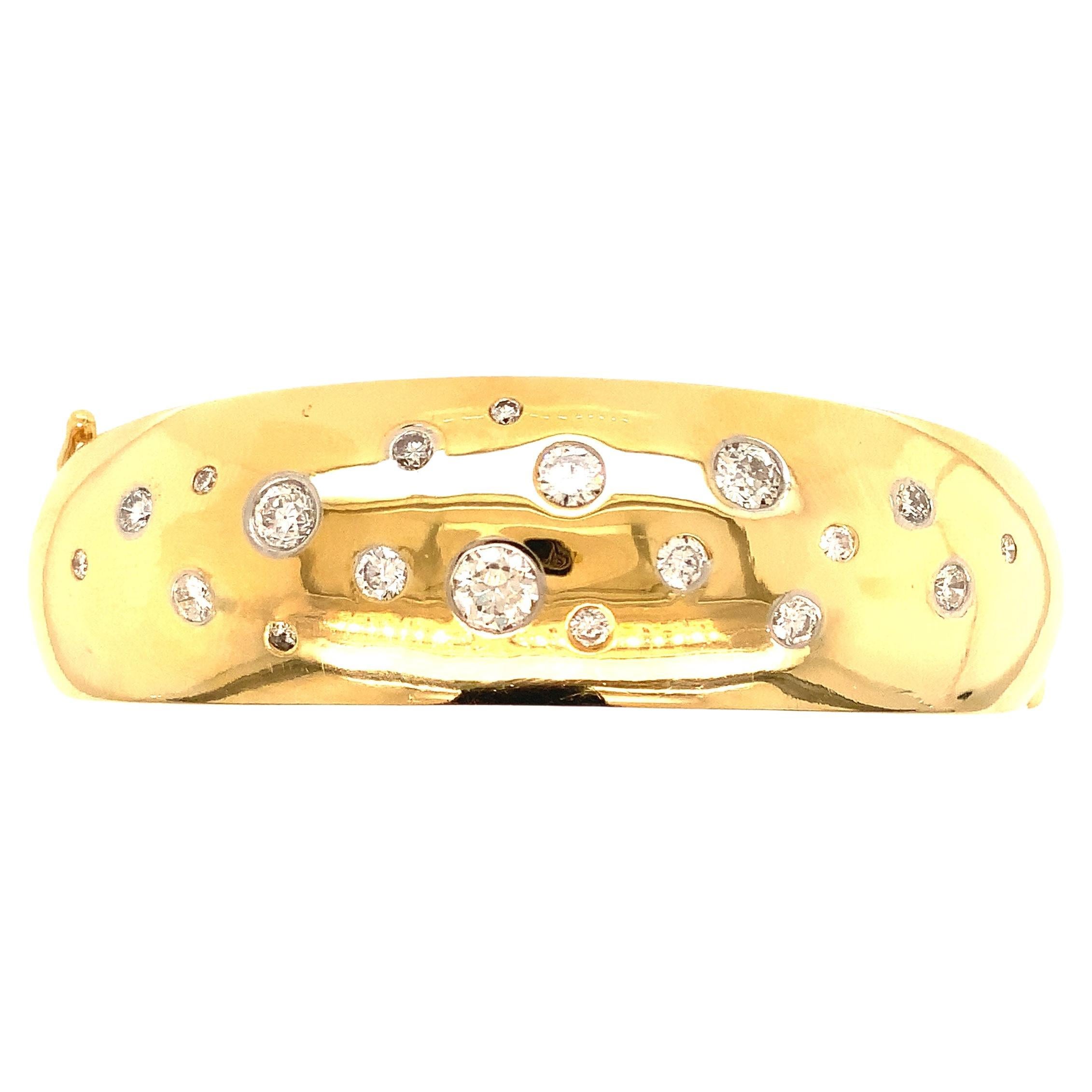 This one-of-a-kind Vintage Heavy 18 kt yellow Gold Handmade Italian Diamond Bangle features 19 Flush Set Polished and graduated Bezel Set Diamonds graduating from 0.06 to 0.25 carat each, totaling 1.46 carats. The 19 brilliant-cut diamonds boast a