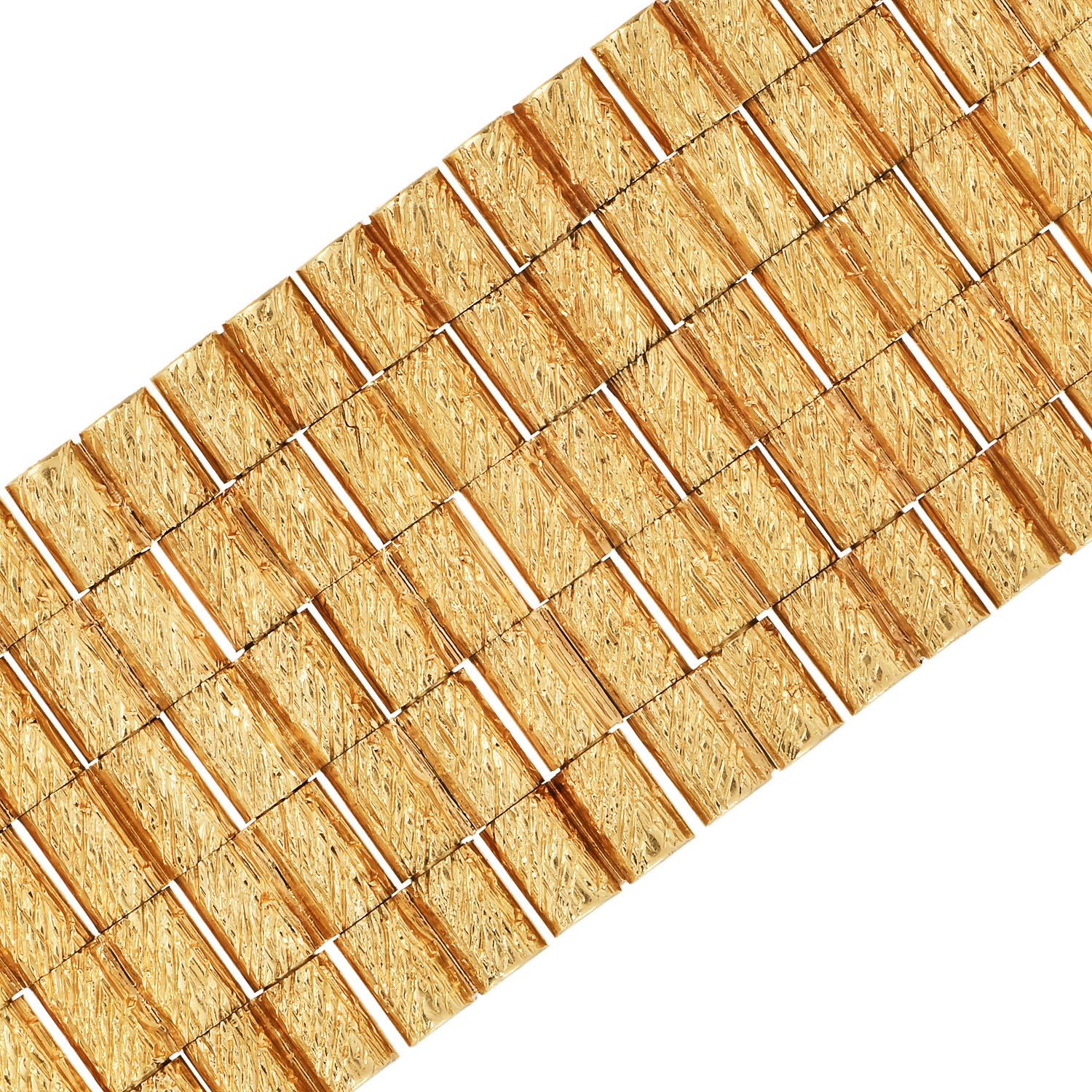 This  Vintage unisex bracelet looks luxurious and timeless.

 The circa 1980s Vintage bracelet with Bark-Finish link is crafted in 18K yellow gold.

This Matte Gold bracelet weighs in total 106.0 Grams and Measures approx. 7.50