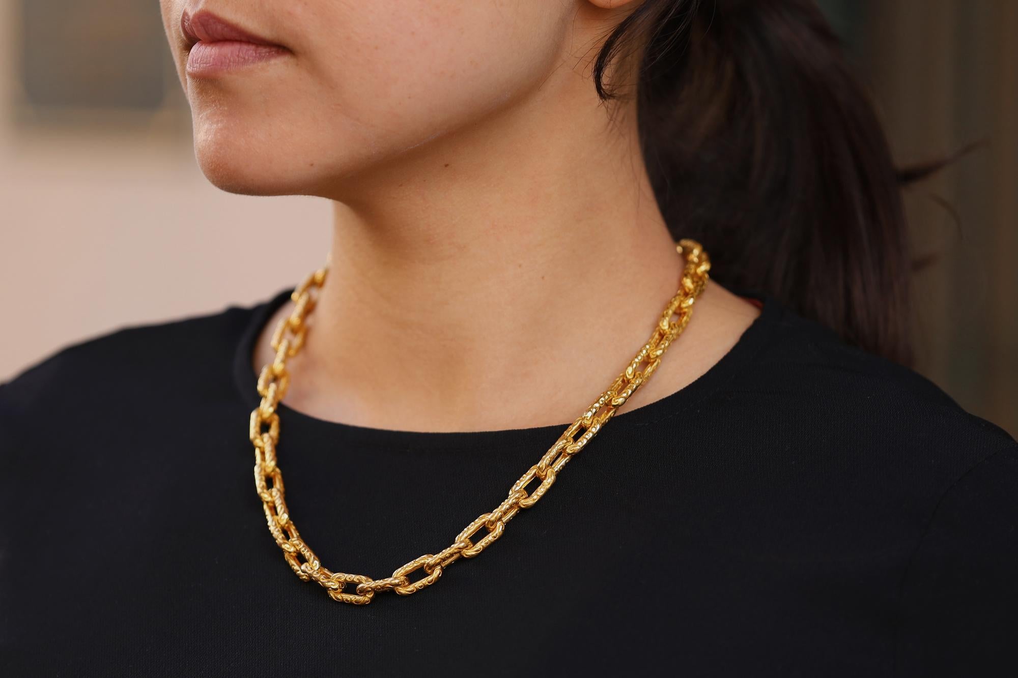 A vintage yellow gold lovers dream! At nearly 5 ounces of pure gold, this stunning statement showcases a timeless design matched with an incredibly detailed artisanal craftsmanship. The classic chain links are delectably engraved with flourishes and
