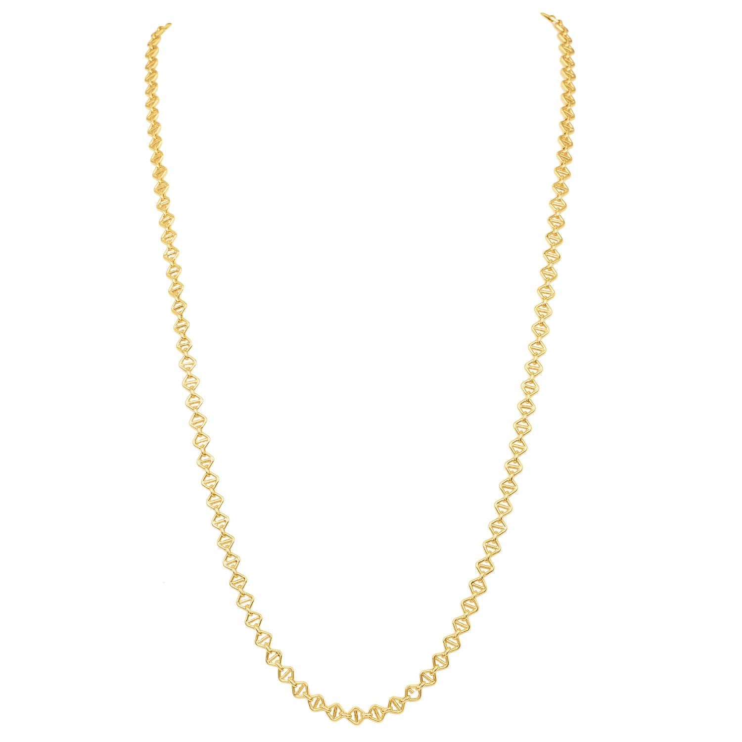 A timeless piece of fine jewelry, this elegant Guchi link chain necklace is crafted in solid 18K yellow gold with a refined textured link design. The intricate pattern on each link creates depth and dimension, catching the light beautifully with