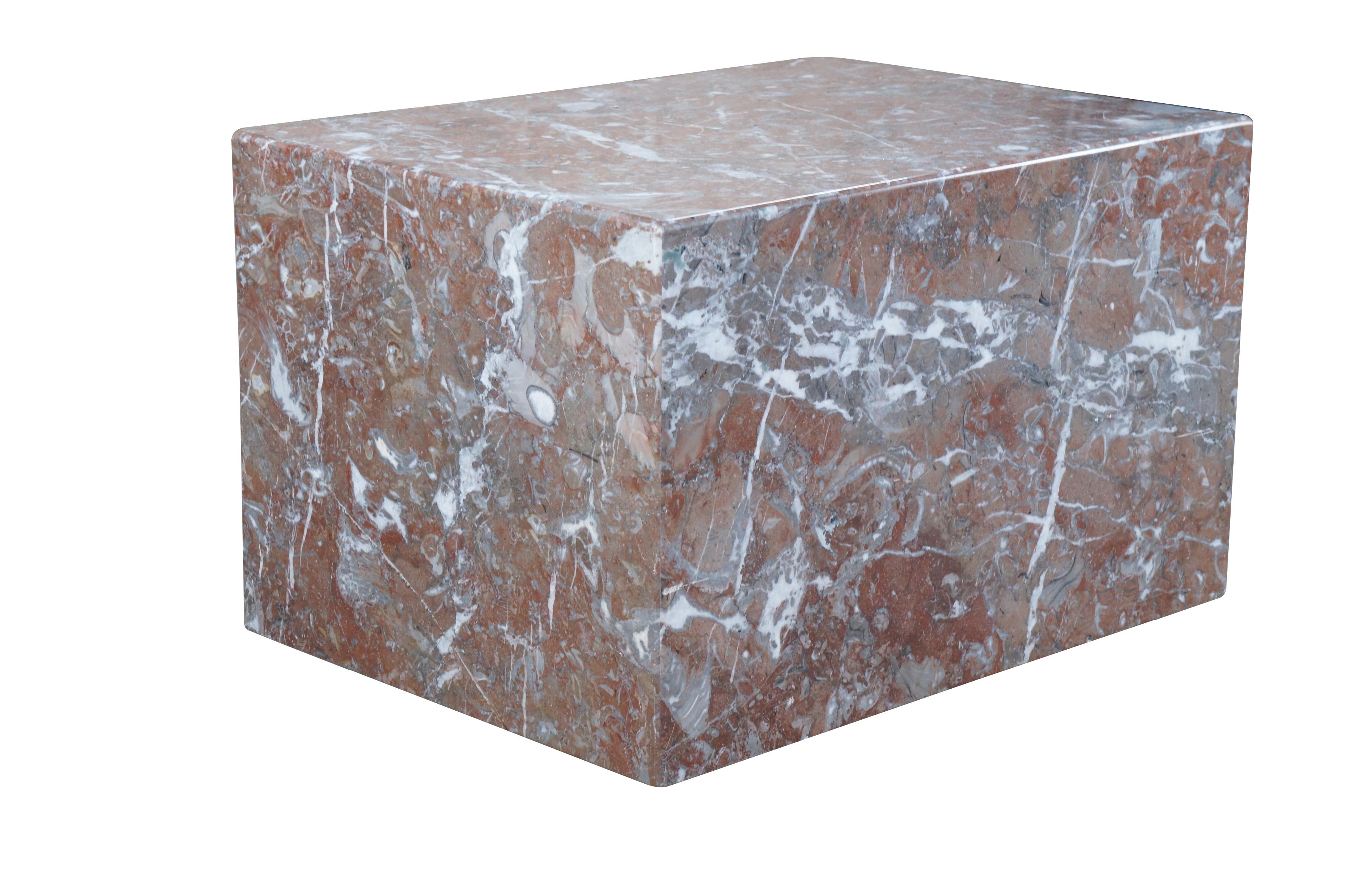 Italian minimalist cube form plinth, circa 1970s. Made from marble with pink and grey color.  The perfect base to display any heavy object, sculpture or statue. Can also be used as an end, side or coffee table.  The plinth is extremely heavy.  2