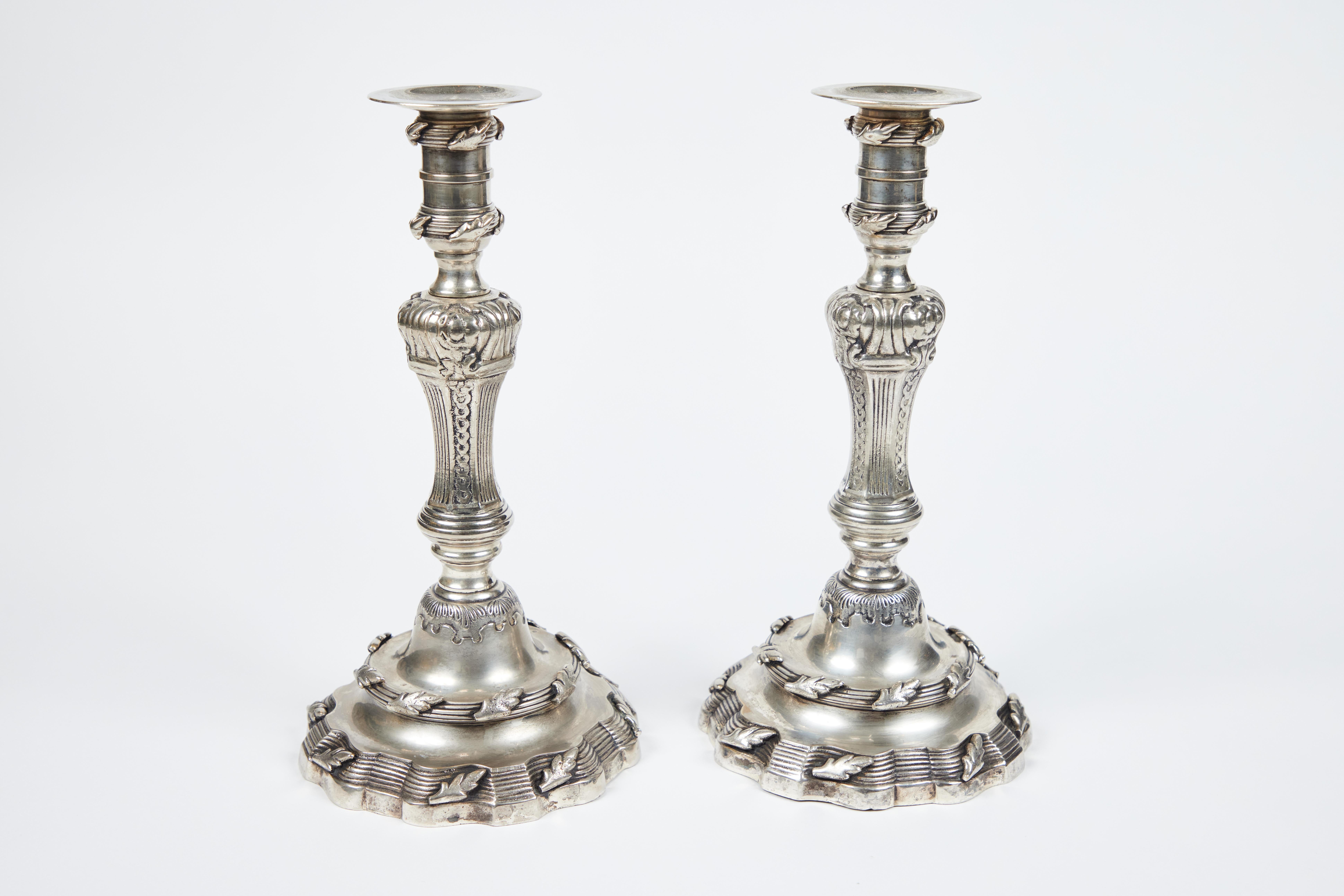 Our pair of oversized vintage heavy silverplate candle sticks are quite elegant. Ornately decorated from the top to the base with lots of leaf and pattern detailing, they are truly a dramatic statement. They would be an impressive addition to any