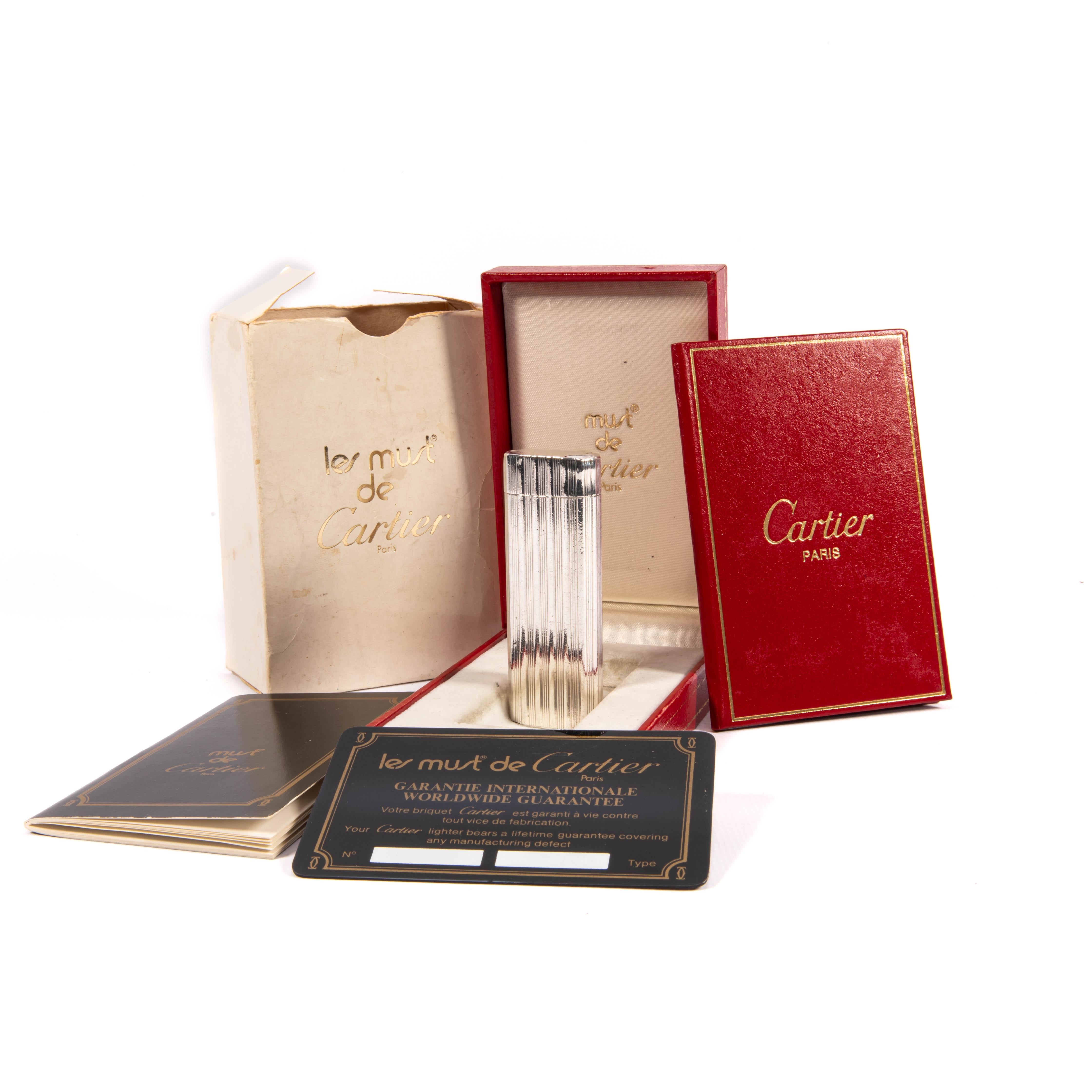 Vintage Solid Silver Sleeved Cartier Les Must lighter

This rare, custom-made Cartier Les Must lighter, crafted with a solid 925 silver sleeve, is an exquisite collector’s piece and a testament to Cartier’s timeless craftsmanship. Produced in the