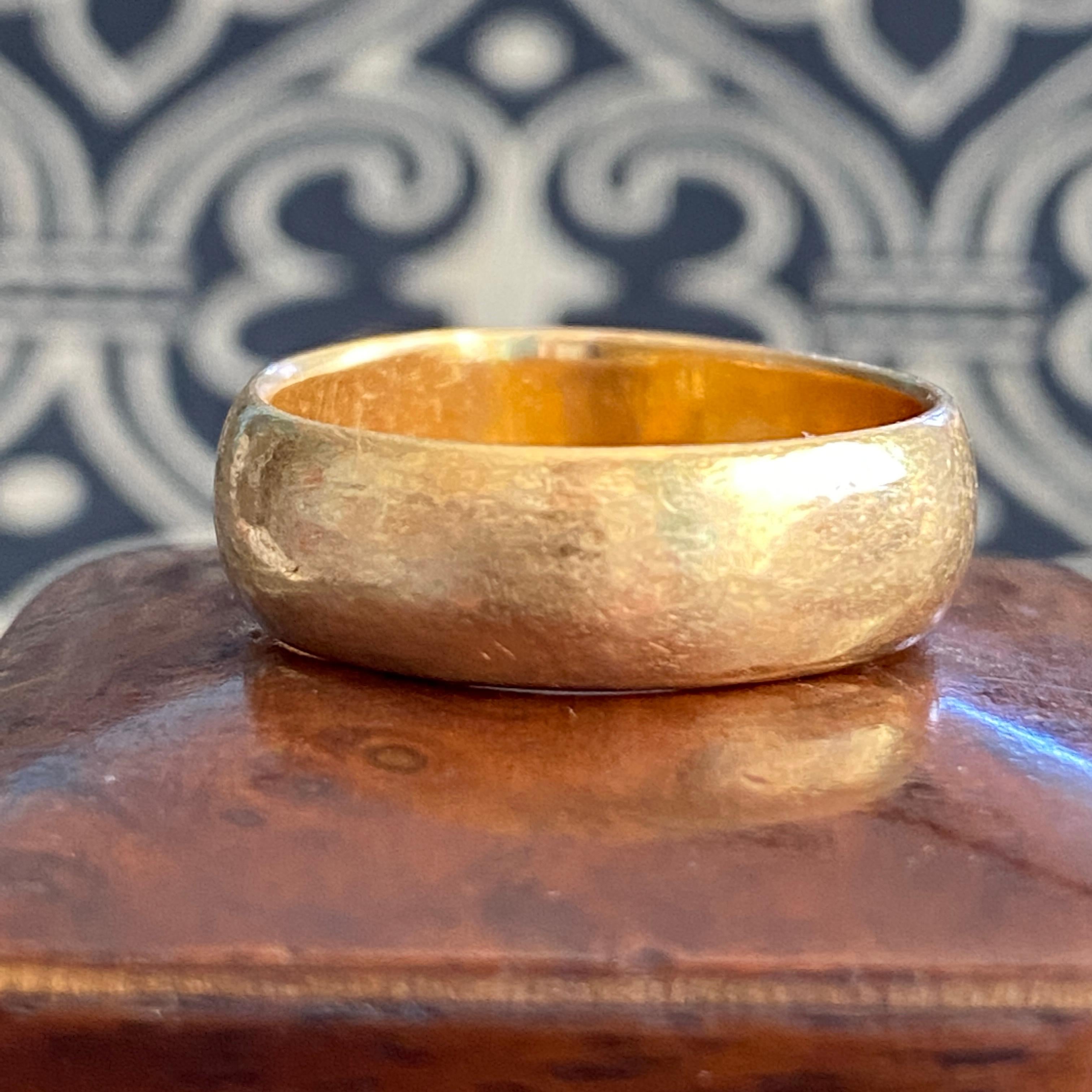 Details:
Gorgeous chunky wide vintage wedding band in buttery 22K yellow gold! It is so lovely, and soft. It has a rounded fit, and is very comfortable on your hand. This band would pair nicely with a diamond band or another 22K ring! The ring has