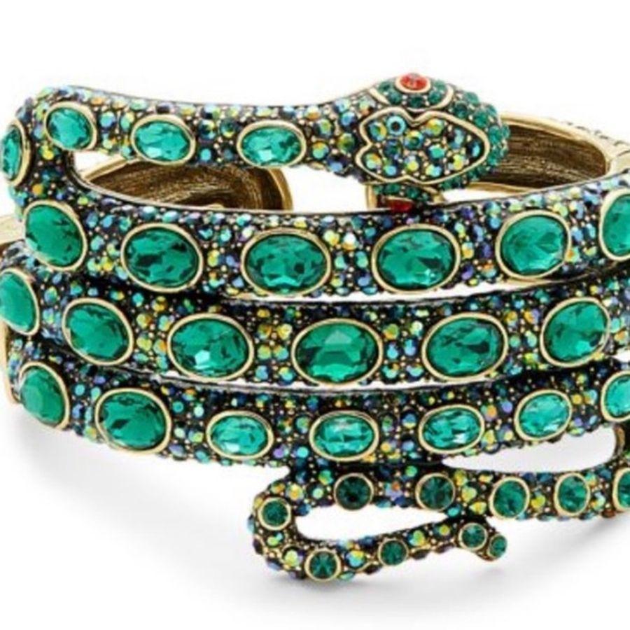Simply Fabulous! Wrap this modern and sophisticated Exotic Beautifully detailed Snake Serpent Hinged Cuff Bracelet by Designer Heidi Daus around your wrist. Encrusted with sparkling Green Crystals. Measuring approx. 2.05