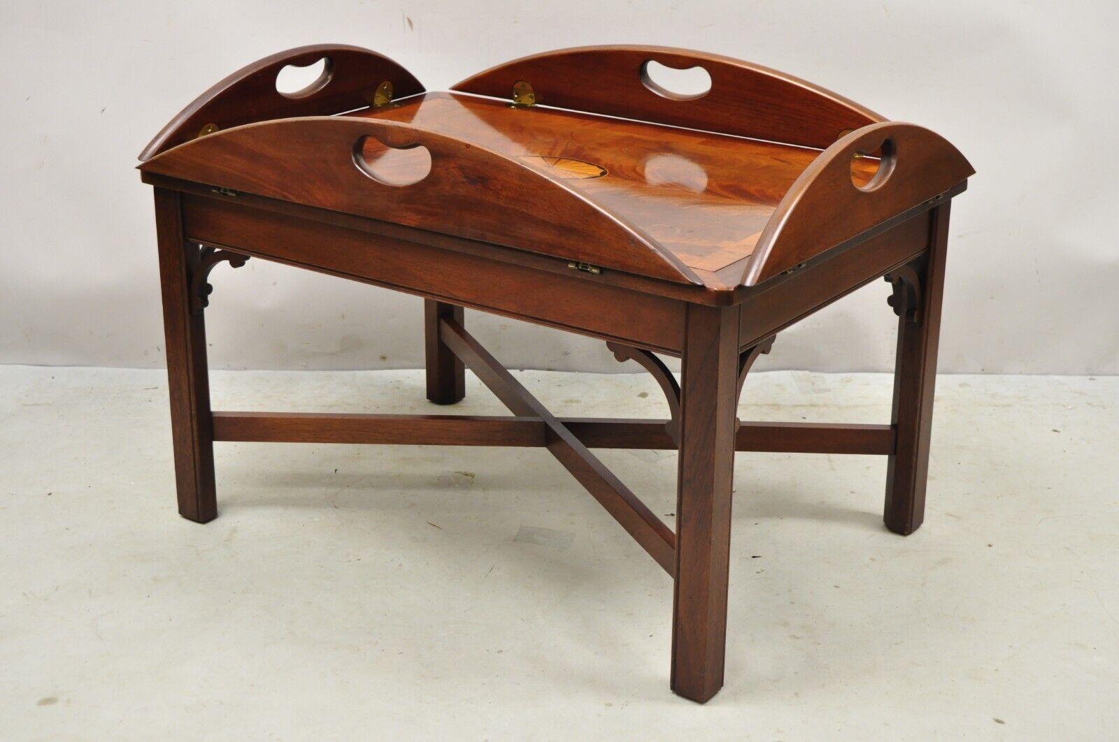 Vintage Hekman Butlers Tray Table Mahogany Coffee Table w/ Pinwheel Inlay.
Item features a pinwheel inlay top, fold down sides, beautiful wood grain, original stamp, quality American craftsmanship, great style and form. Circa Late 20th Century.