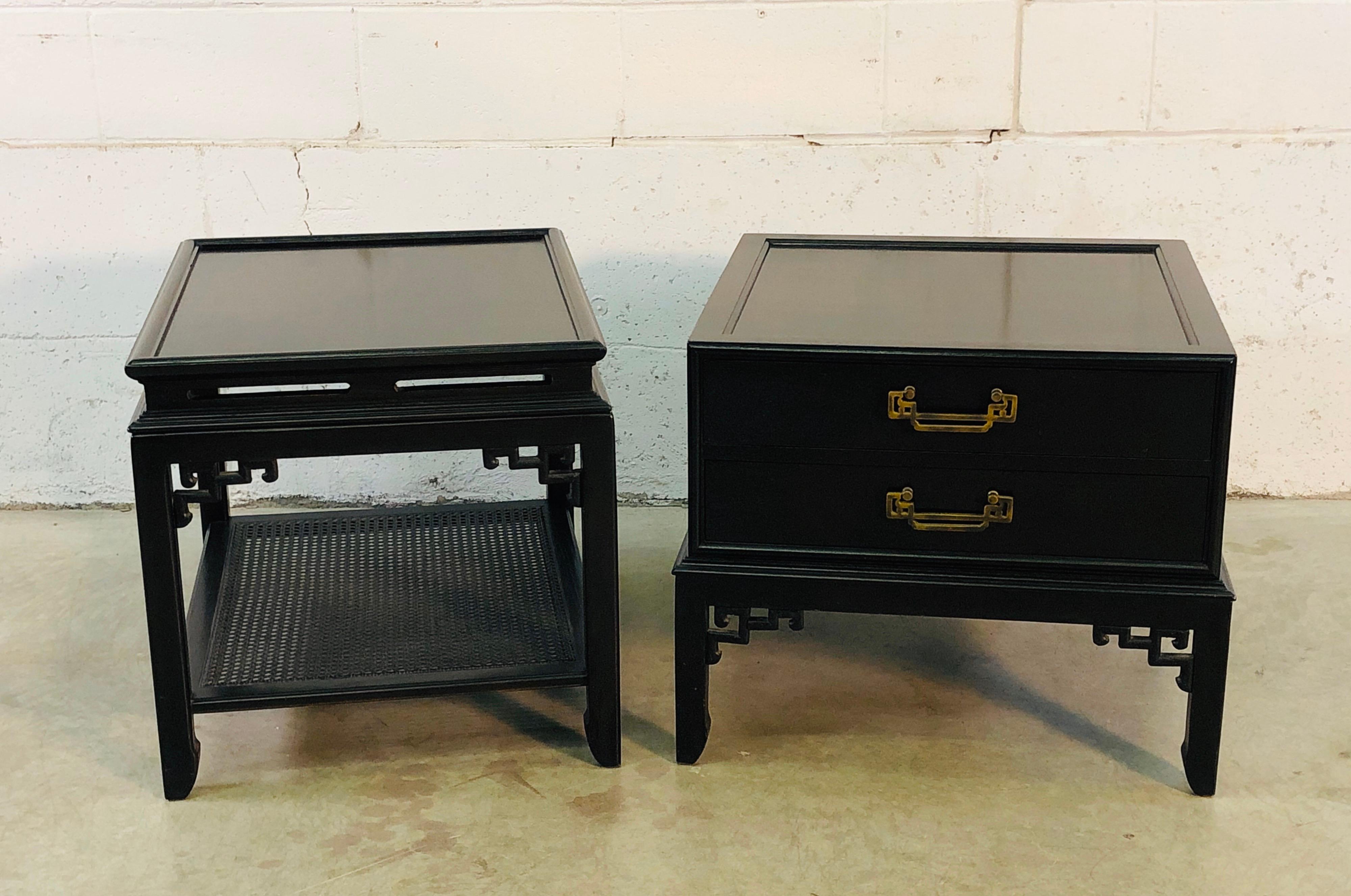 Vintage pair of Hekman Furniture Co black lacquered Asian Modern side tables. One table has two drawers for storage with brass pulls. This table measures 25.5” L x 25.5” W x 21.25” H and is marked in the drawer. This table is square. The other side