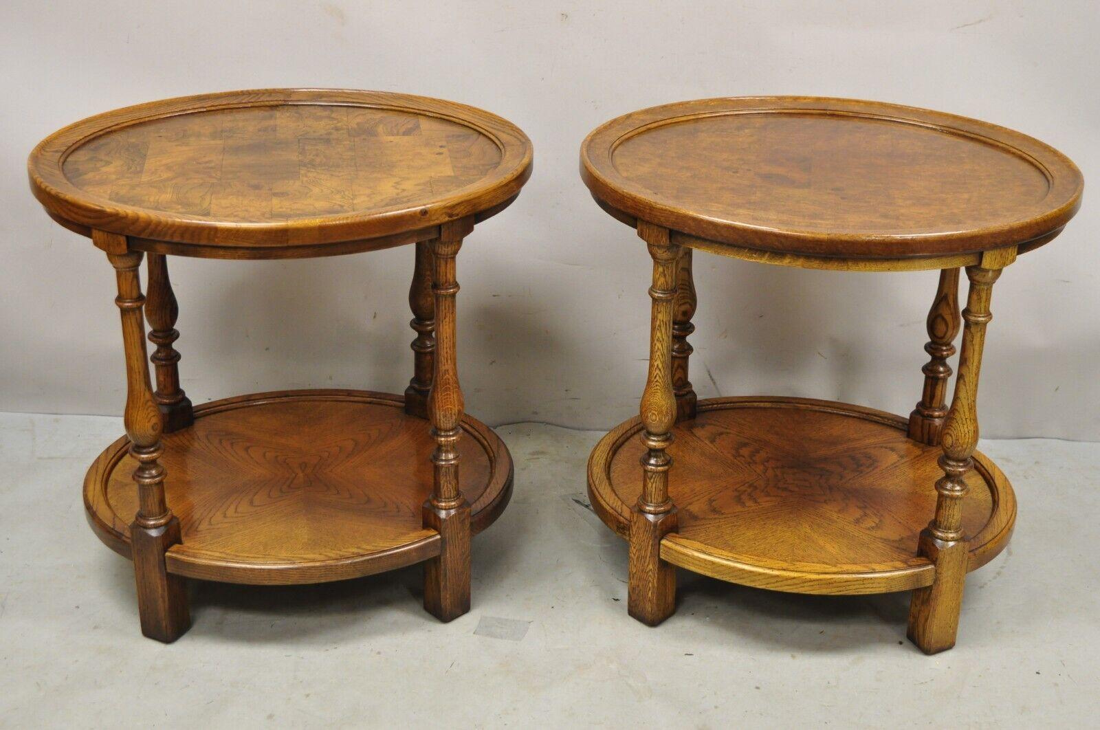 Vintage Hekman Italian Provincial Style Oak & Burlwood Two Tier Oval End Tables - a Pair. Circa Mid to Late 20th Century. 
Measurements: 25