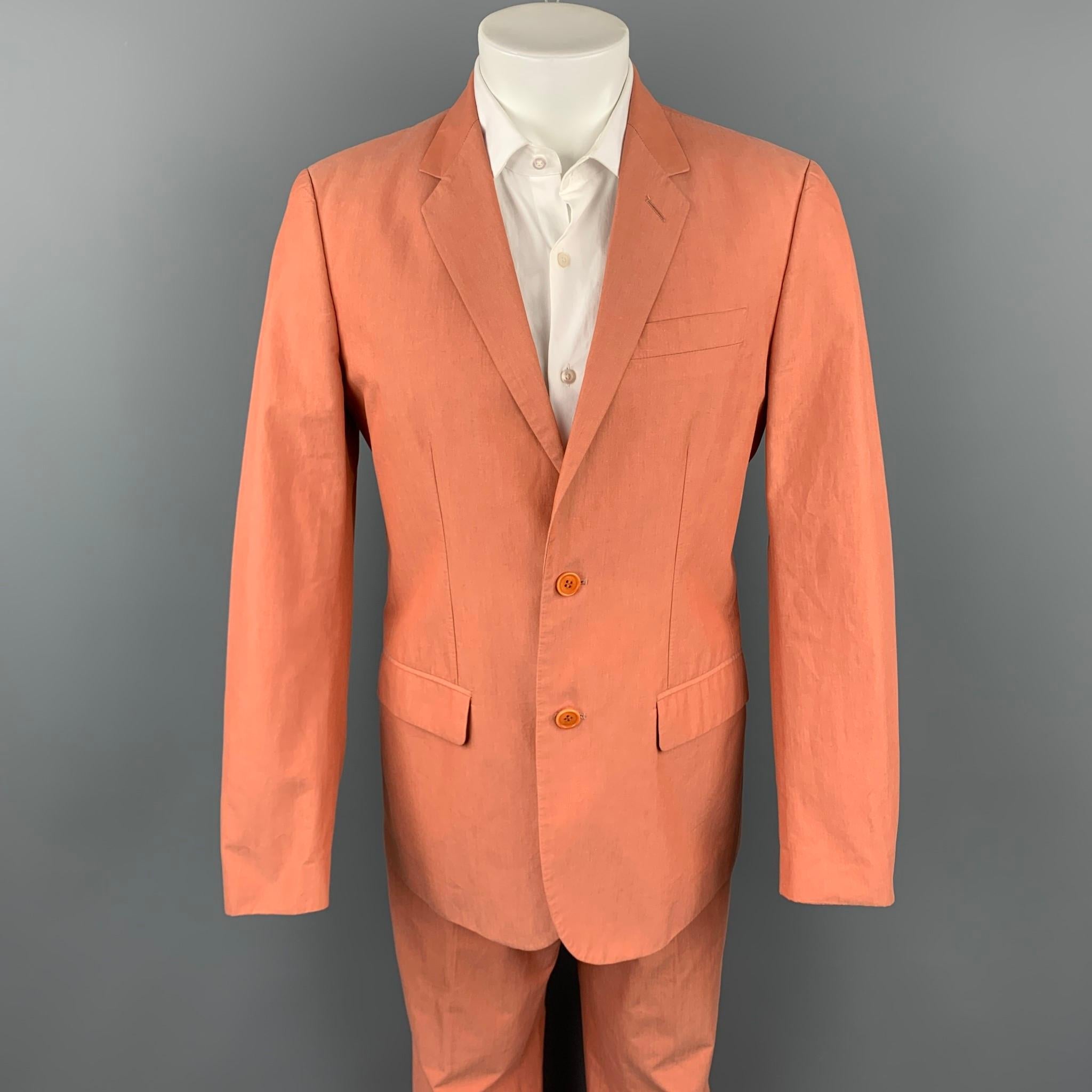 Vintage HELMUT LANG suit comes in a coral cotton with a full liner and includes a single breasted, two button sport coat with a notch lapel and matching flat front trousers. Made in Italy.

Good Pre-Owned Condition.
Marked: IT
