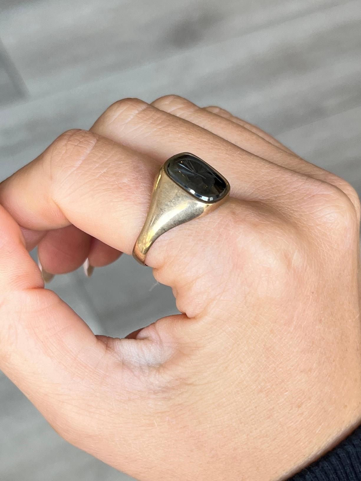 This glossy and shiny Hematite signet ring has a beautifully engraved soldier on the face. Made in Birmingham, England 1977.

Ring Size: W 1/4 or 11 1/4 
Stone Face dimensions: 10x12mm

Weight: 4g
