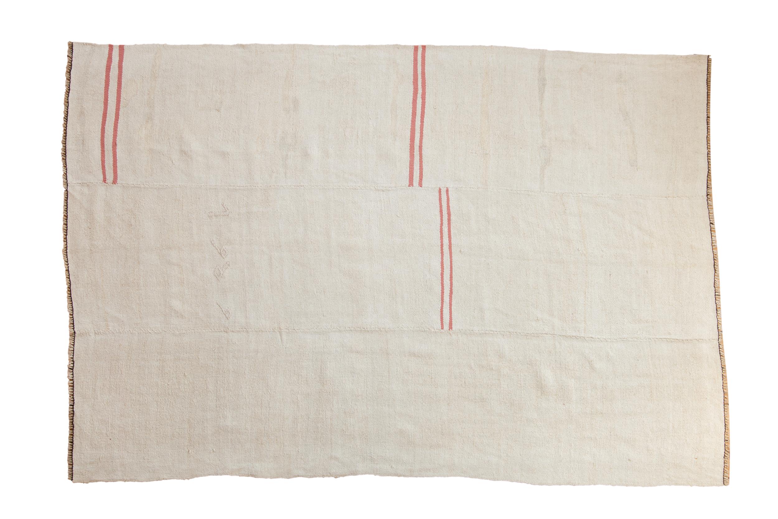 :: Plain-weave kilim with multi-piece construction and simplistic and offset horizontal stripes. Colors and shades include: Platinum, silver, beige, ivory, pink, grapefruit, jet black, and more. Condition notes: Weave across in mostly original